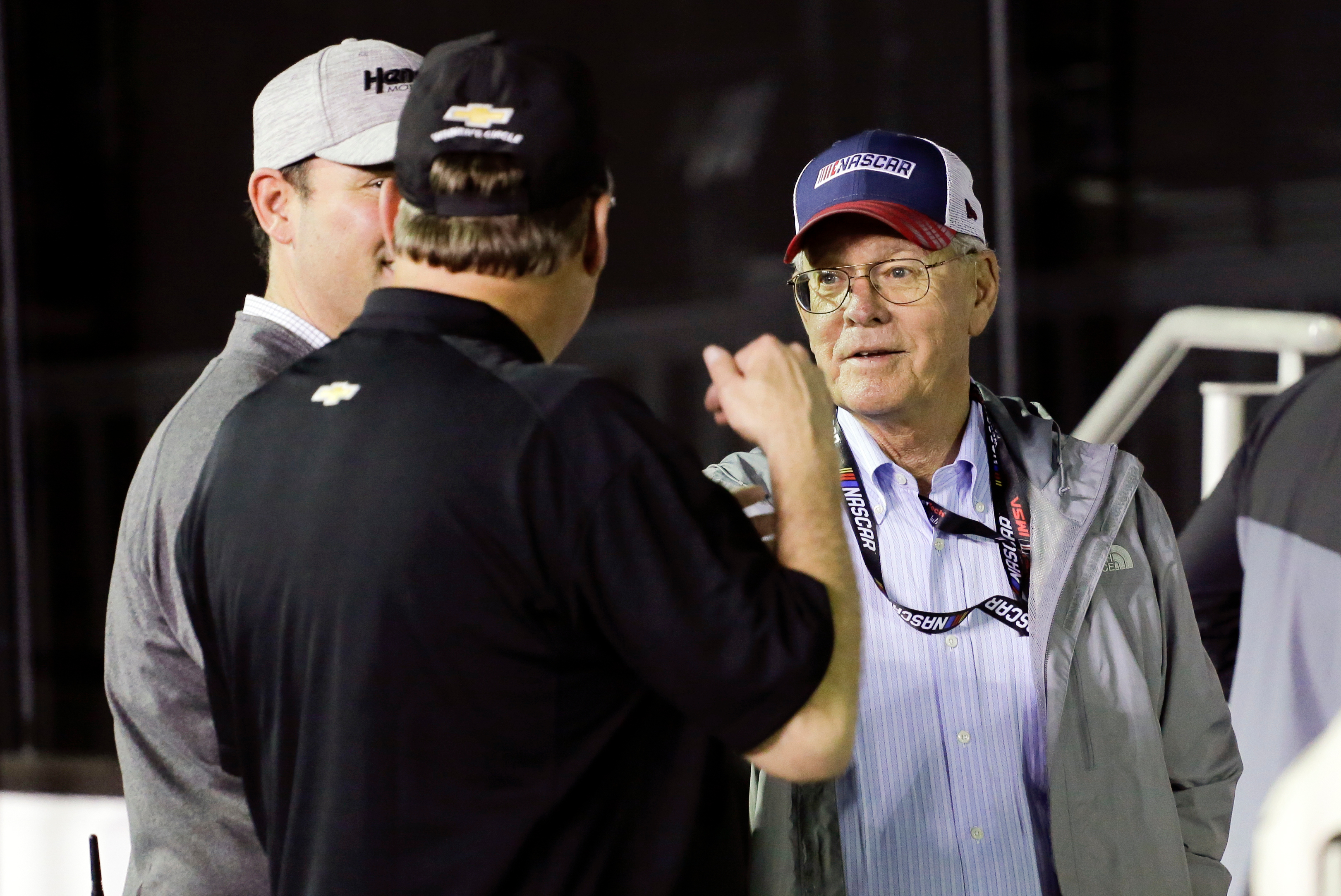 FILE - Jim France, right, chairman and executive vice president of NASCAR, talks with sponsors in Victory Lance after the second of two NASCAR Daytona 500 qualifying auto races at Daytona International Speedway, Thursday, Feb. 13, 2020, in Daytona Beach, Fla. (AP Photo/Terry Renna, File_