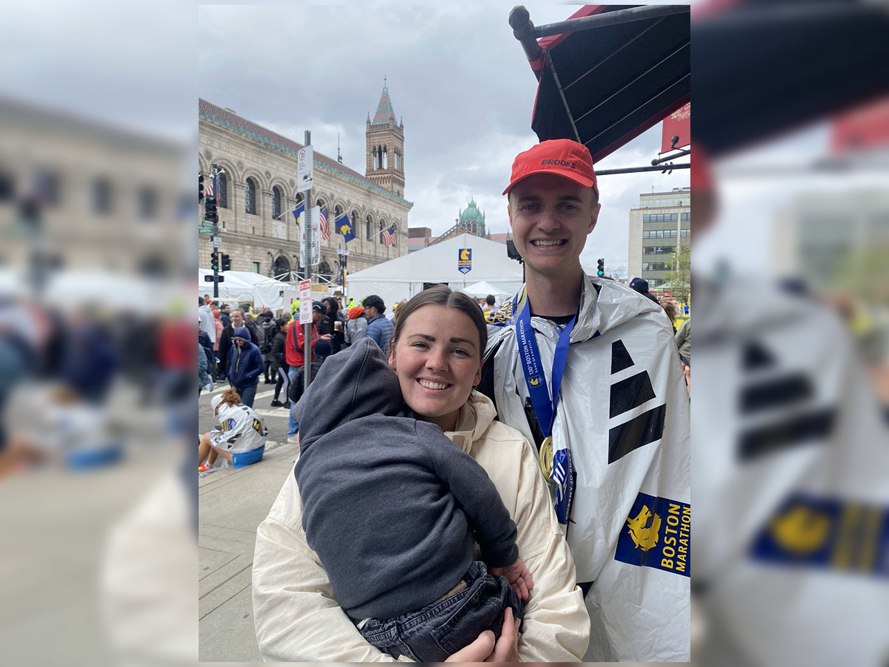 Derek Bonney and his wife, Amber Bonney, pose for a picture at the site of the Boston Marathon on April 20. Amber Bonney had given birth to their second son, James, two days day prior.