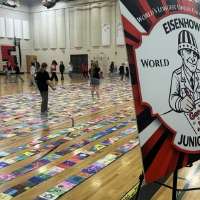 Eisenhower Junior High students attempt world record for longest line of coloring pages