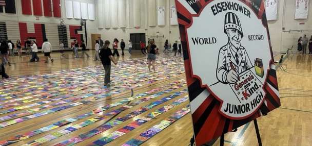 Eisenhower Junior High students attempt world record for longest line of coloring pages