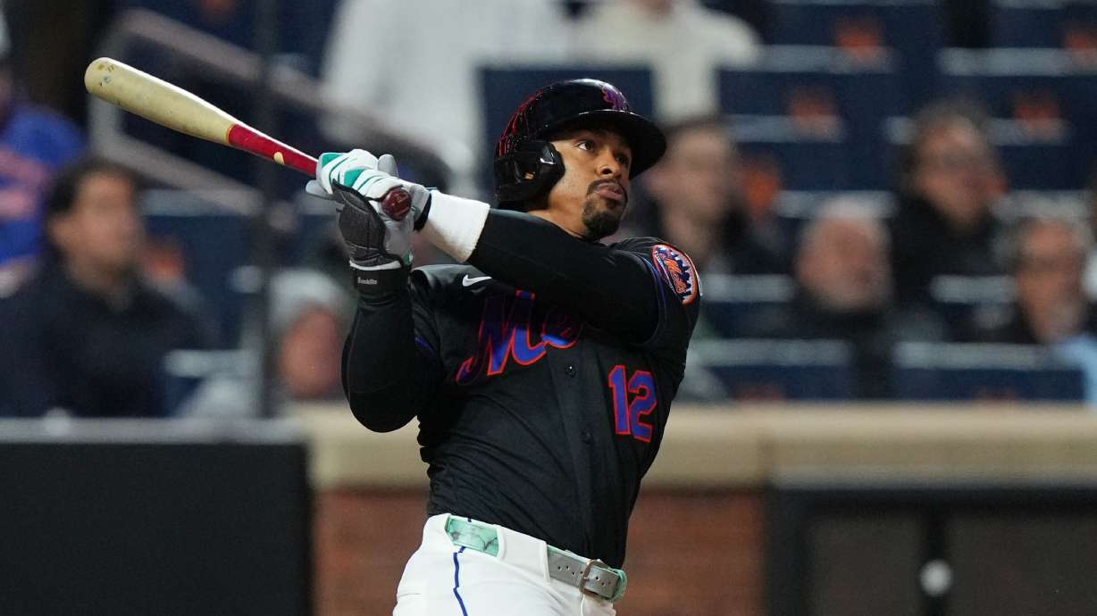 New York Mets' Francisco Lindor follows through on a three-run home run during the third inning of a baseball game against the Minnesota Twins Tuesday, April 21, 2026, in New York.