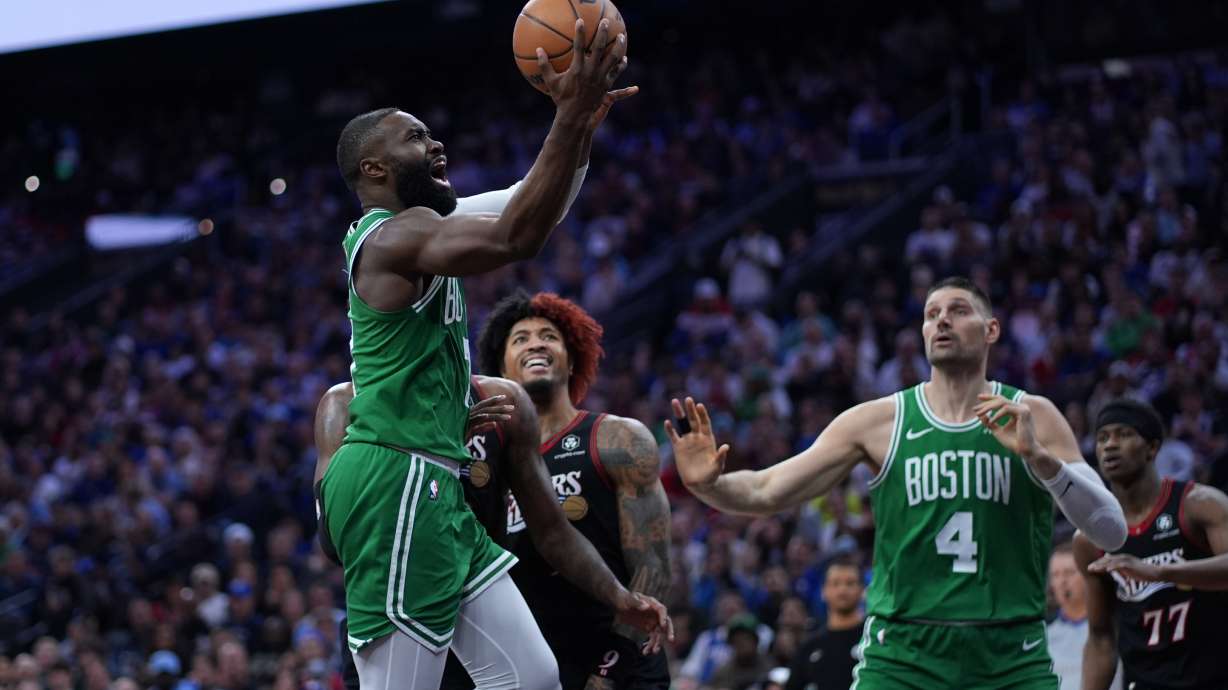 Boston Celtics' Jaylen Brown, left, goes up for a shot past Philadelphia 76ers' Kelly Oubre Jr. during the first half of Game 3 in a first-round NBA playoffs basketball series Friday, April 24, 2026, in Philadelphia.