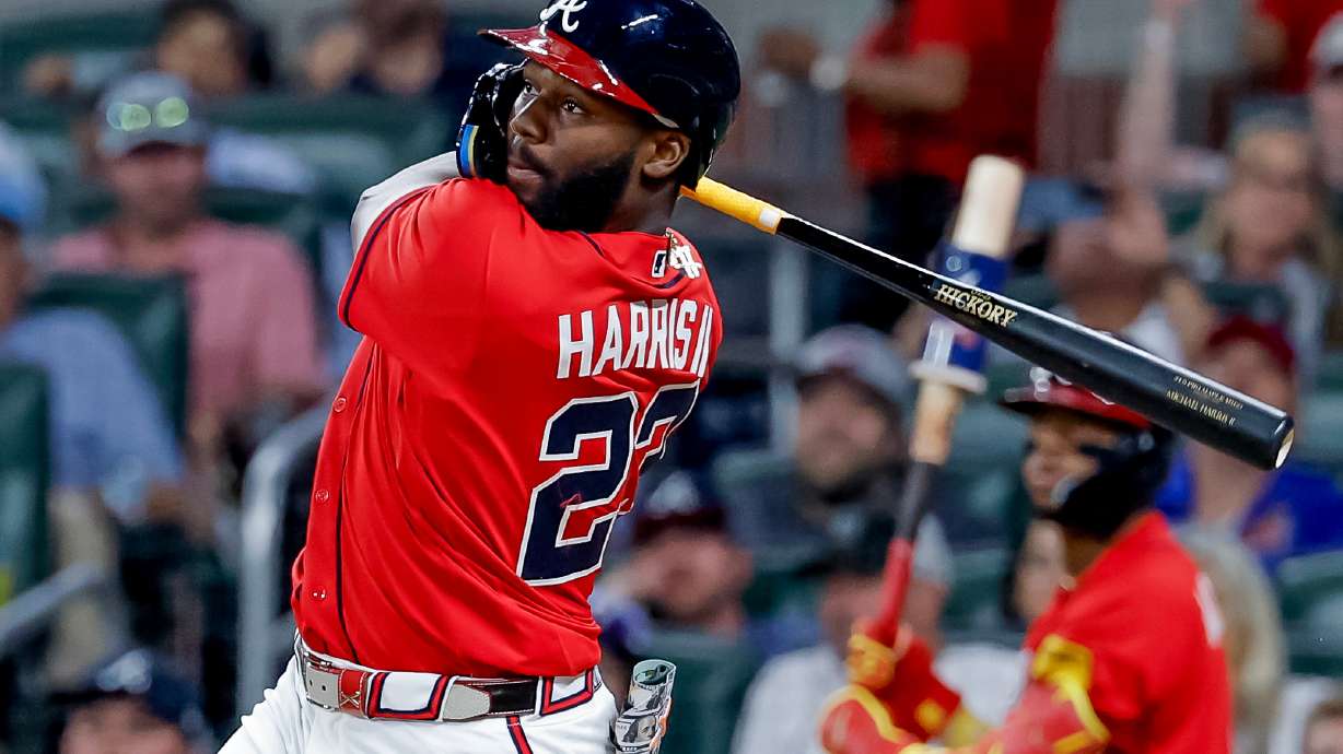 Atlanta Braves pinch hitter Michael Harris II (23) follows through on a two-RBI double against the Philadelphia Phillies during the sixth inning of a baseball game, Friday, April 24, 2026, in Atlanta.