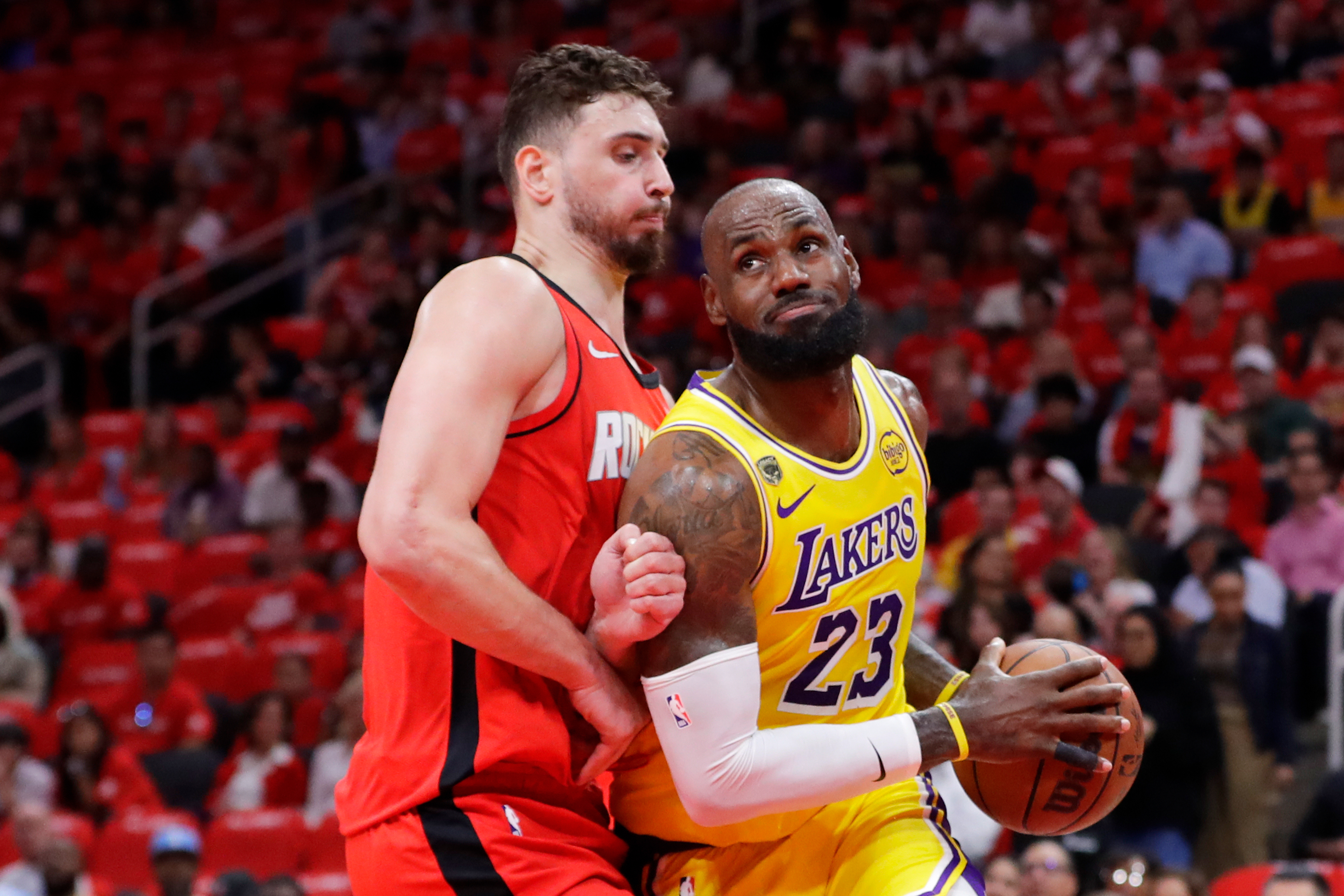 Los Angeles Lakers forward LeBron James (23) drives to the basket in front of Houston Rockets center Alperen Sengun, left, during the first half of Game 3 in a first-round NBA playoffs basketball series Friday April 24, 2026, in Houston. 