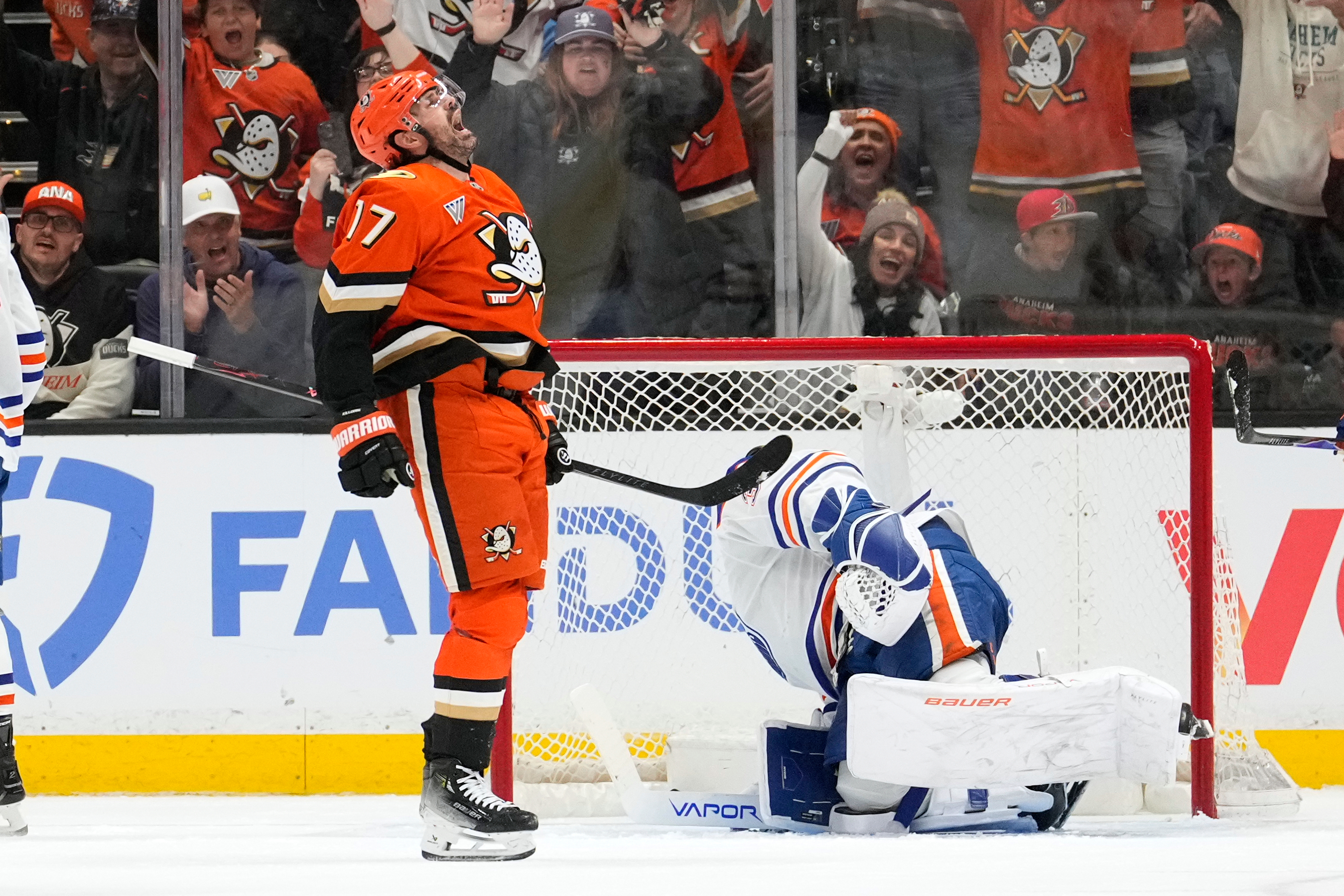 Anaheim Ducks left wing Alex Killorn, left, celebrates his goal as Edmonton Oilers goaltender Connor Ingram sits in goal during the second period of Game 3 in the first round of the NHL hockey Stanley Cup playoffs series Friday, April 24, 2026, in Anaheim, Calif. 