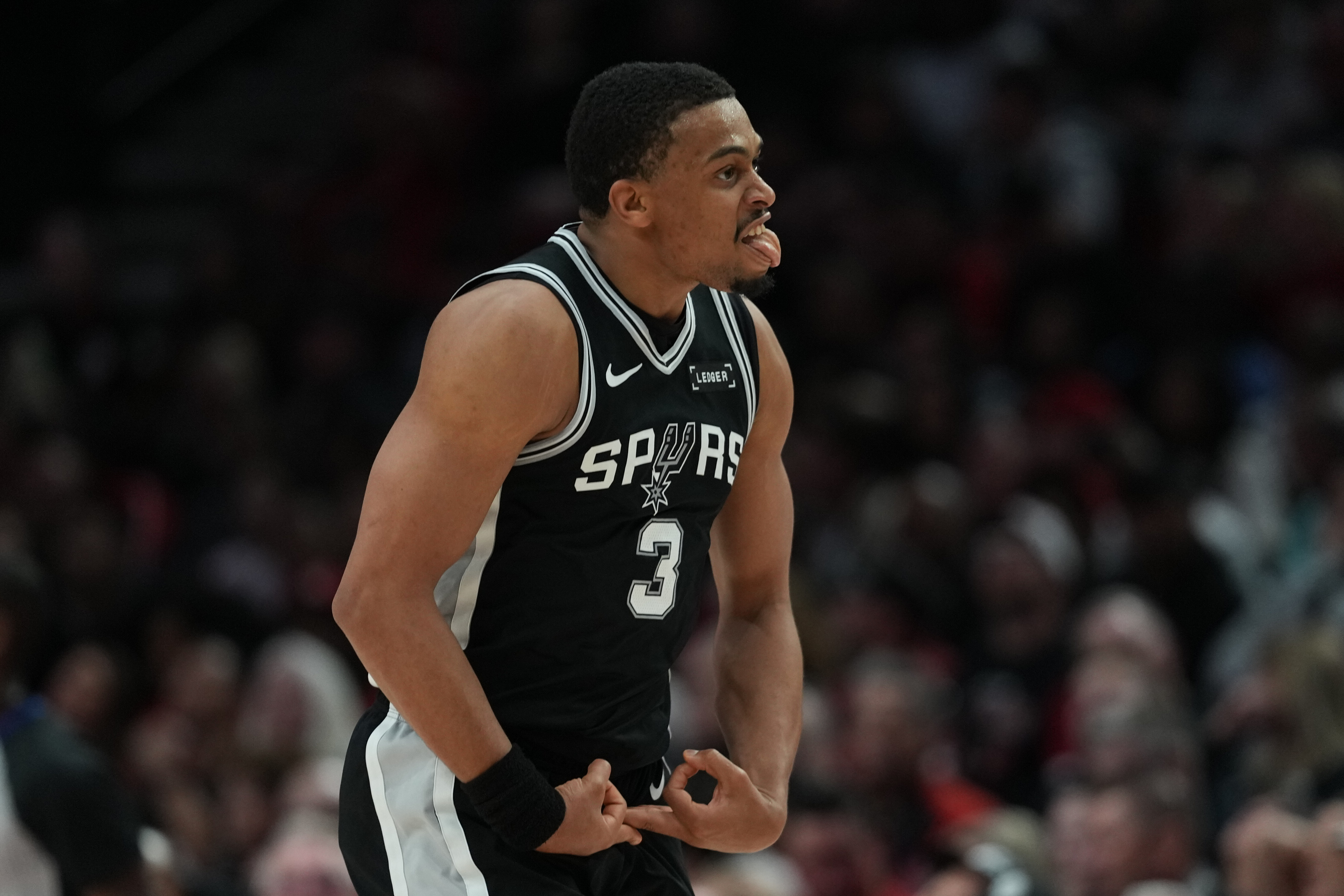 San Antonio Spurs forward Keldon Johnson (3) reacts after scoring against the Portland Trail Blazers during the second half in Game 3 of a first-round NBA playoffs basketball series in Portland, Ore, Friday, April 24, 2026. 