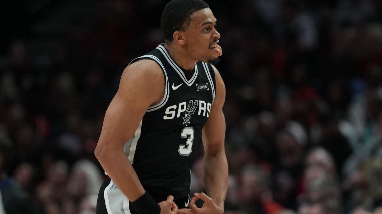 San Antonio Spurs forward Keldon Johnson (3) reacts after scoring against the Portland Trail Blazers during the second half in Game 3 of a first-round NBA playoffs basketball series in Portland, Ore, Friday, April 24, 2026.