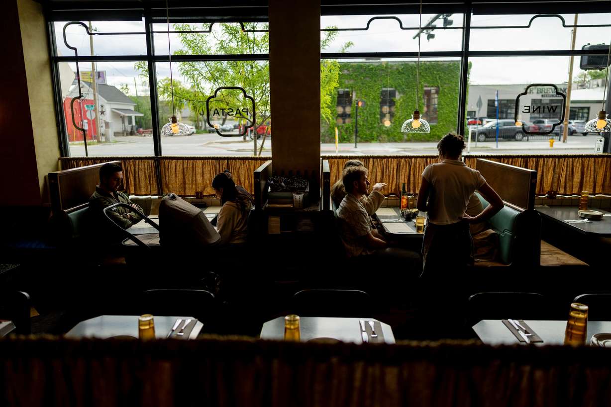 People dine at Cosmica in Salt Lake City on April 15. The restaurant was named as one of The New York Times' best restaurants, the first honor for a Utah restaurant in over a decade.