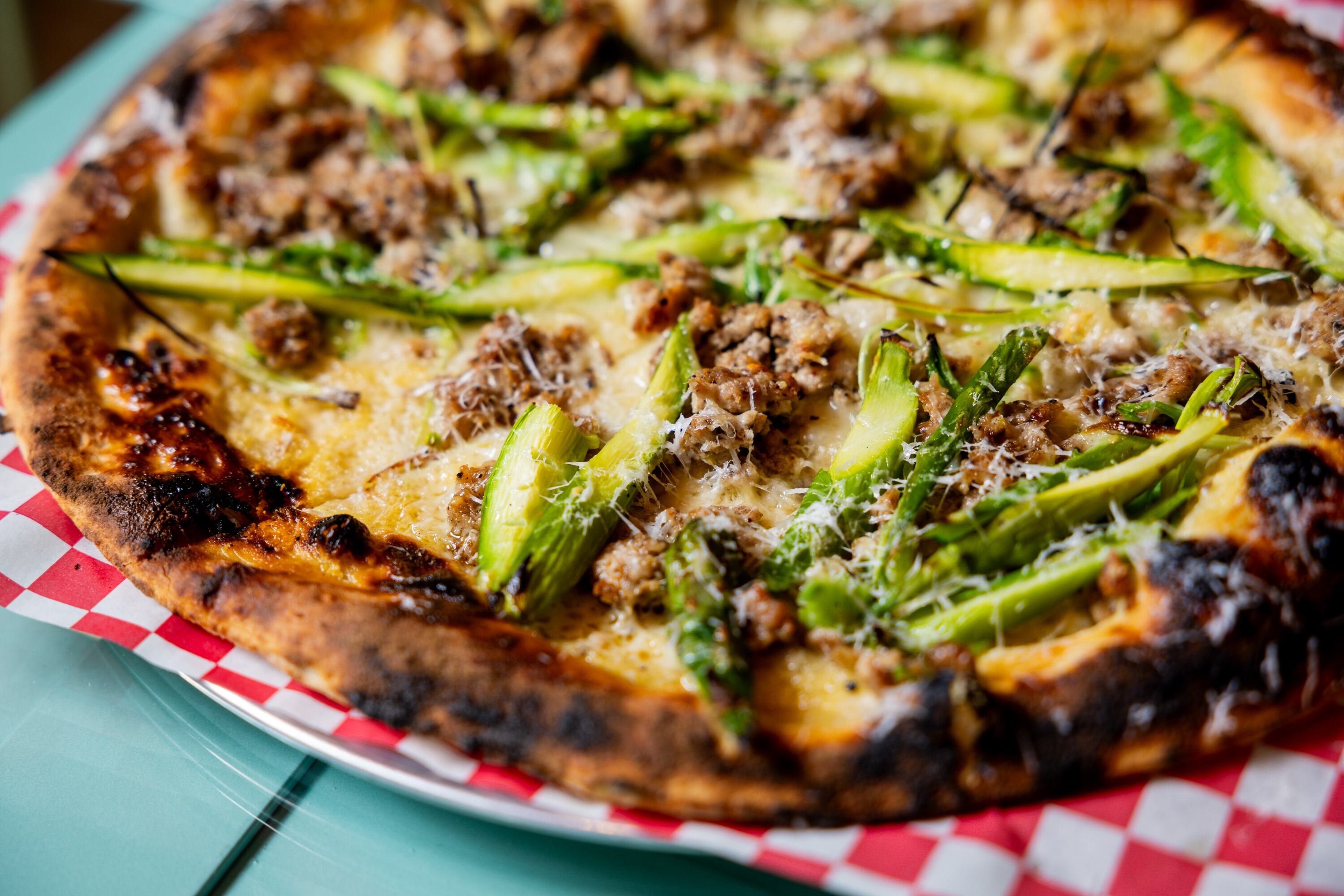 A house-made fennel sausage pizza with spring onion, asparagus and ossau-iraty cheese at Cosmica in Salt Lake City on April 15. The restaurant was the first in Utah to be named as one of The New York Times' best restaurants in over a decade.