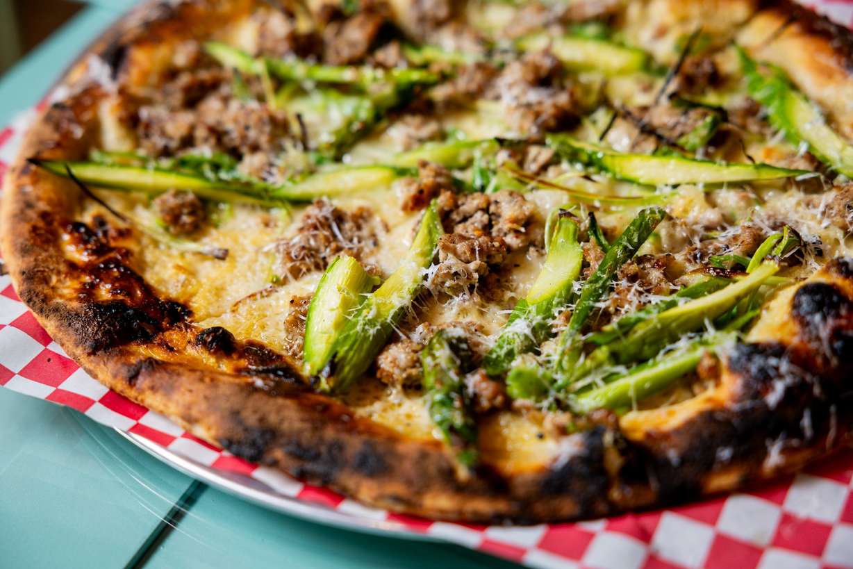 A house-made fennel sausage pizza with spring onion, asparagus and ossau-iraty cheese at Cosmica in Salt Lake City on April 15. The restaurant was the first in Utah to be named as one of The New York Times' best restaurants in over a decade.
