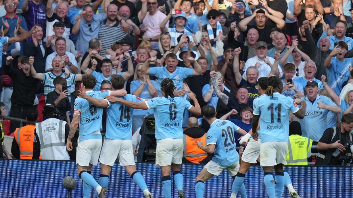Manchester City players celebrate after scoring during the FA Cup semifinal soccer match between Manchester City and Southampton in Manchester, England, Saturday, April 25, 2026.