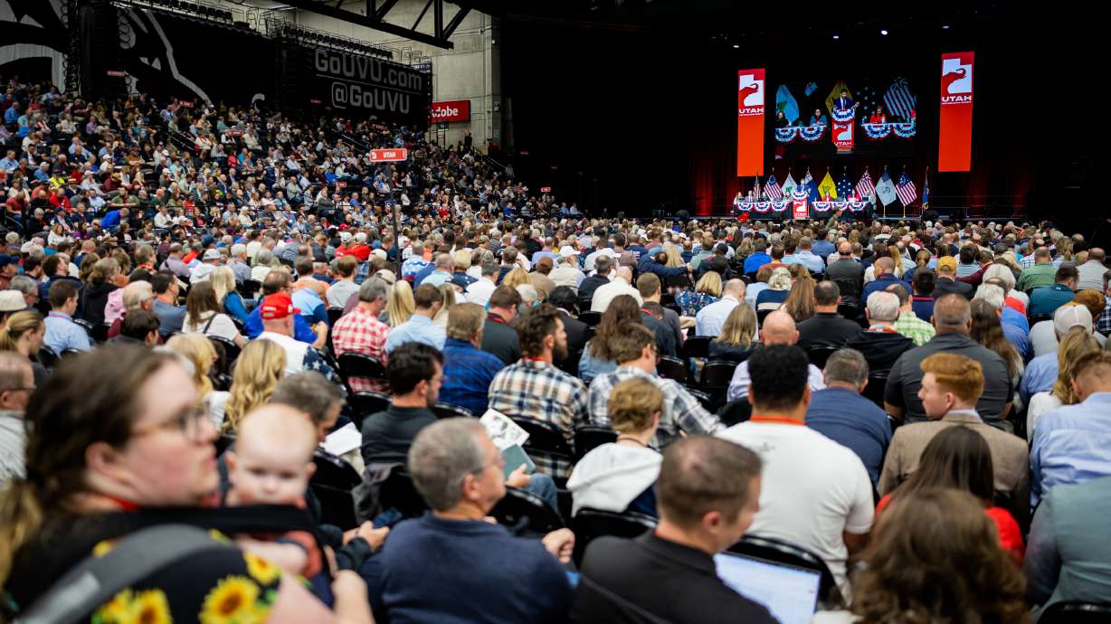 People listen as Utah GOP chair Robert Axson speaks during the Utah Republican Party State Nominating Convention at the UCCU Center in Orem on Saturday.