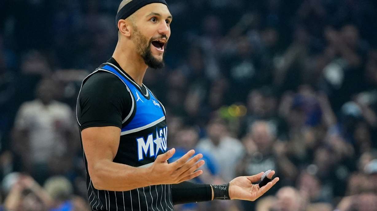 Orlando Magic guard Jalen Suggs interacts with fans after sinking a 3-point shot against the Detroit Pistons during the first half in Game 3 of a first-round NBA basketball playoff series basketball game, Saturday, April 25, 2026, in Orlando, Fla.