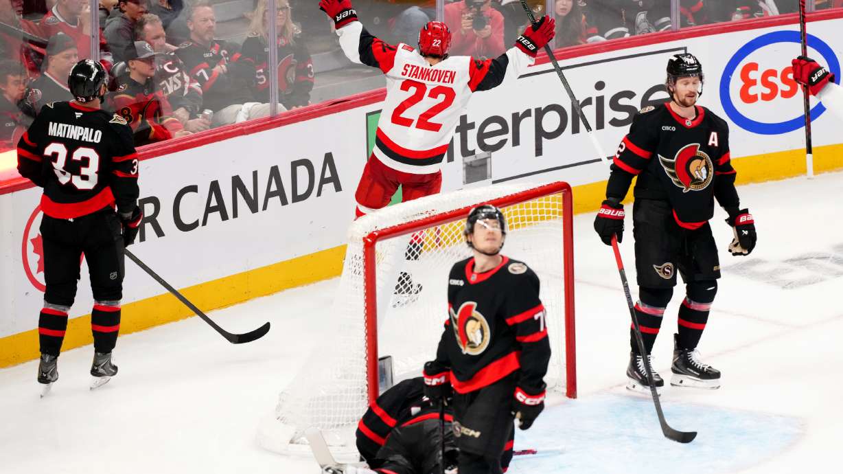 Carolina Hurricanes centre Logan Stankoven (22) celebrates his goal past Ottawa Senators goaltender Linus Ullmark (35) during the third period in Game 4 of a first-round NHL Stanley Cup playoff hockey series, Saturday, April 25, 2026, in Ottawa, Ontario.