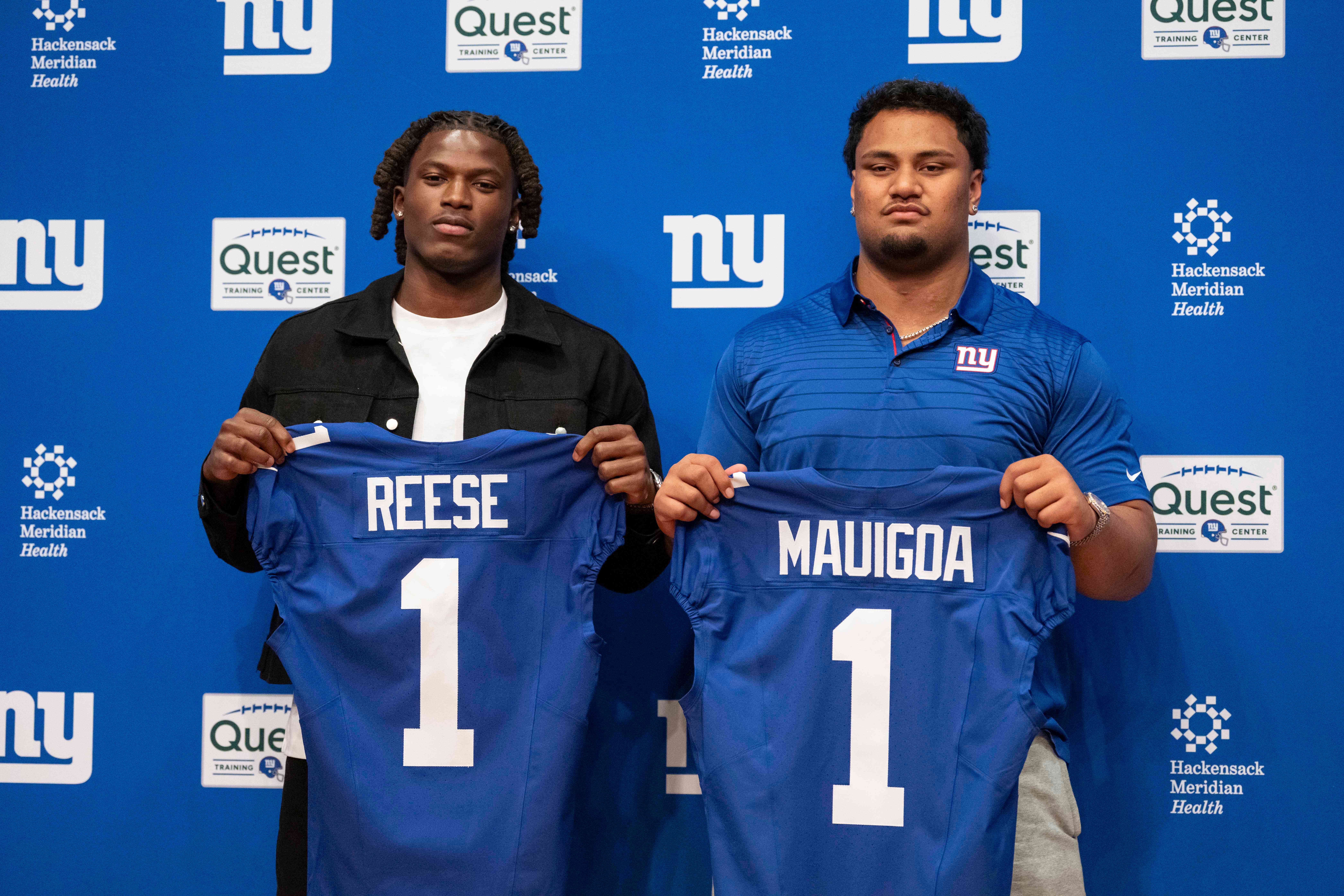 New York Giants' first round draft pick Arvell Reese, left, and Francis Mauigoa, right, pose for a picture during an NFL football press conference at the team's training facility, Friday, April 24, 2026, in East Rutherford, N.J. 