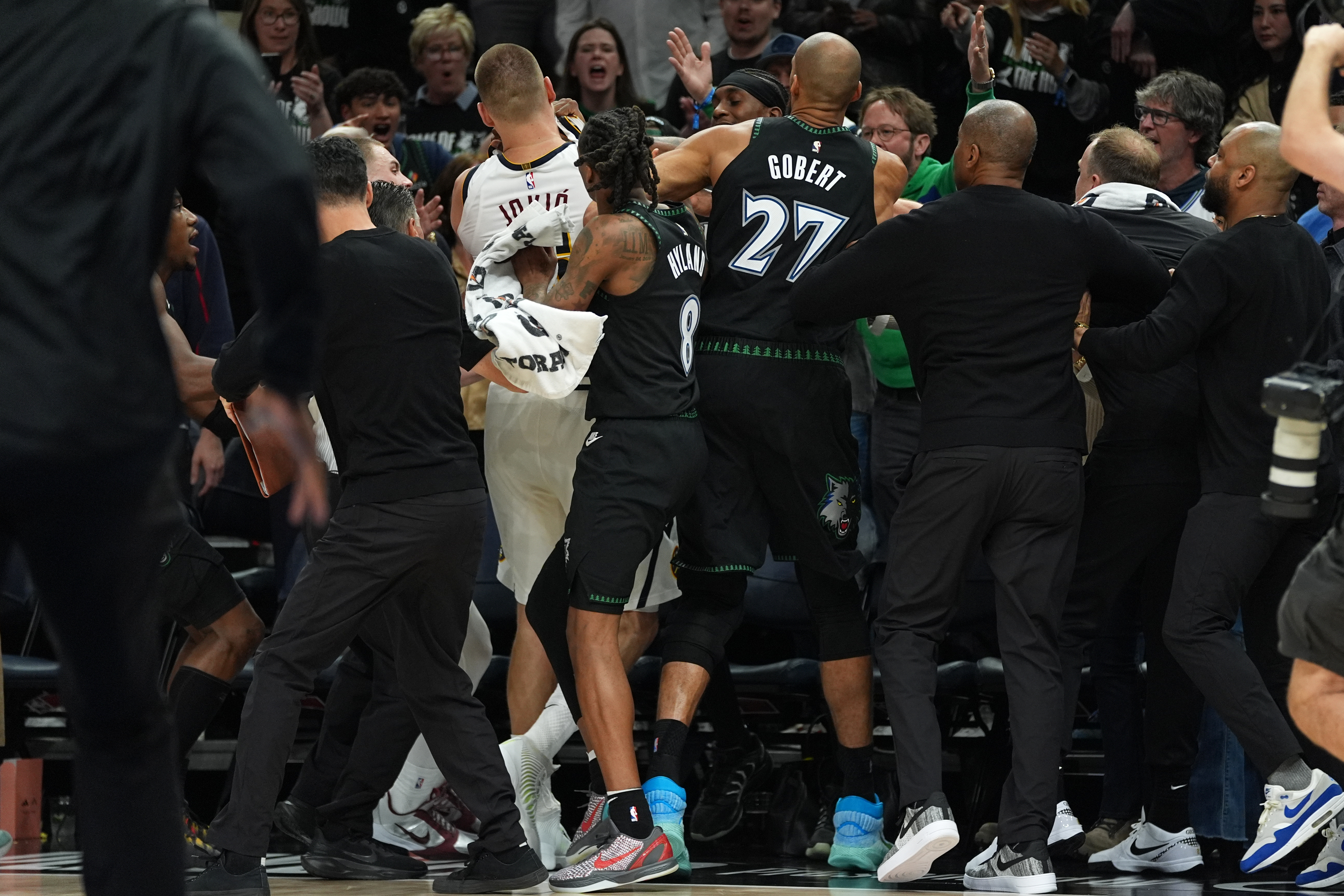 Minnesota Timberwolves and Denver Nuggets players get into an altercation during the second half of Game 4 of a first-round NBA basketball playoff series, Saturday, April 25, 2026, in Minneapolis. 