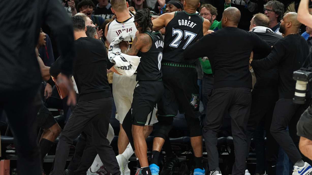 Minnesota Timberwolves and Denver Nuggets players get into an altercation during the second half of Game 4 of a first-round NBA basketball playoff series, Saturday, April 25, 2026, in Minneapolis.
