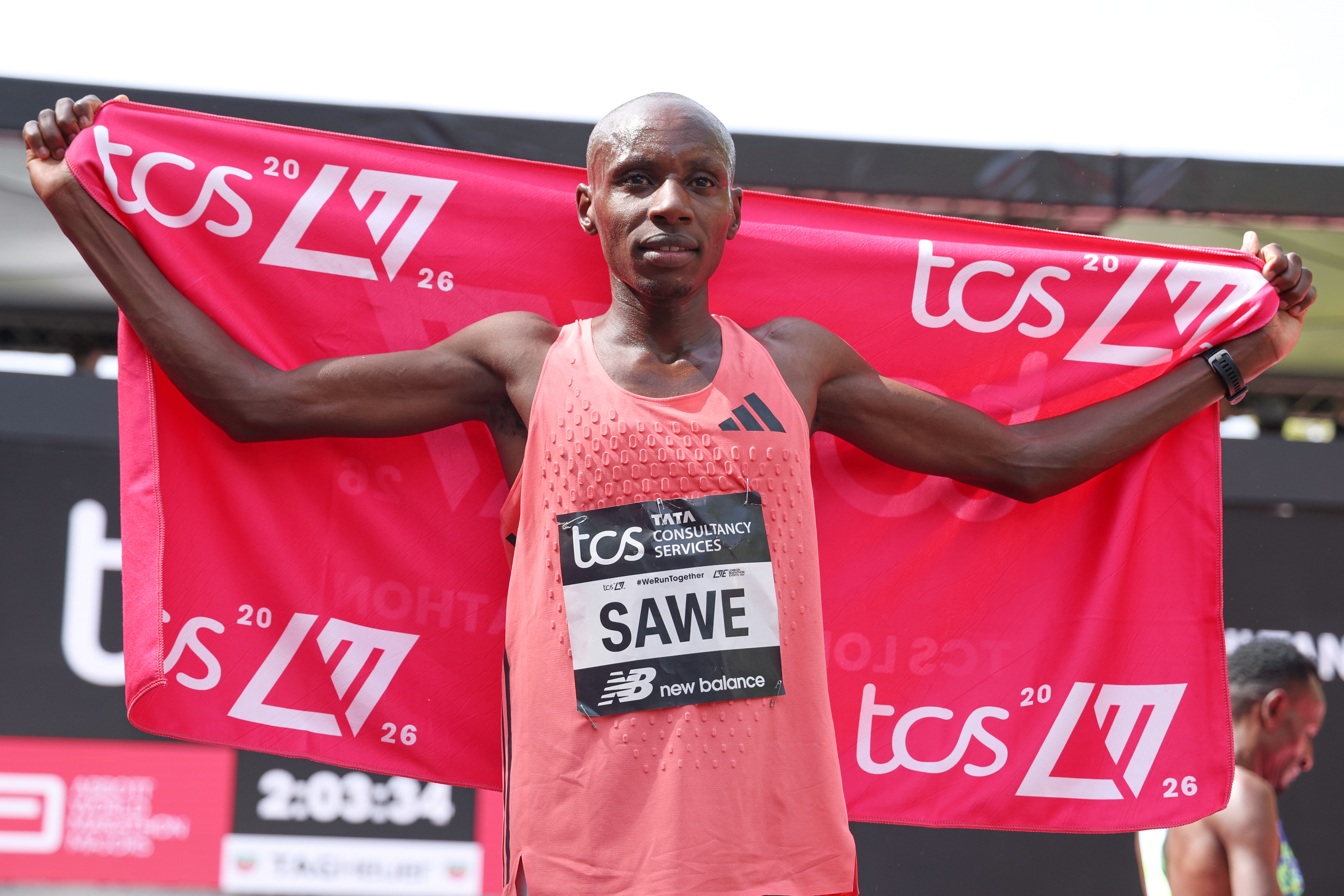 Sebastian Sawe from Kenya celebrates winning the men's race at the London Marathon in London, Sunday, April 26, 2026.