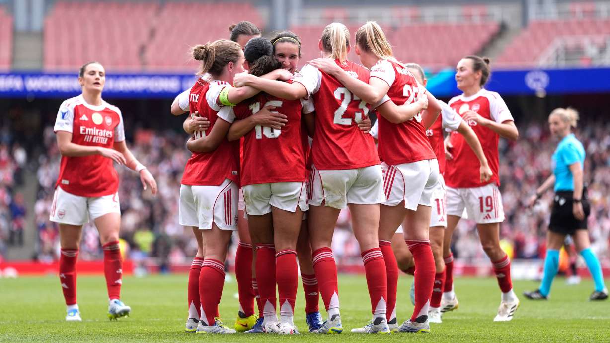 Arsenal's players celebrate their side's second goal scored by Olivia Smith during the Women's Champions League semi-final, first leg soccer match between Arsenal and OL Lyonnes in London, England, Sunday, April 26, 2026.