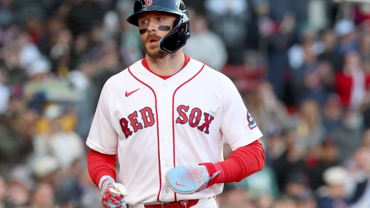Boston Red Sox's Trevor Story runs to the dug out after scoring during the second inning of a baseball game against the New York Yankees, Thursday, April 23, 2026, in Boston.