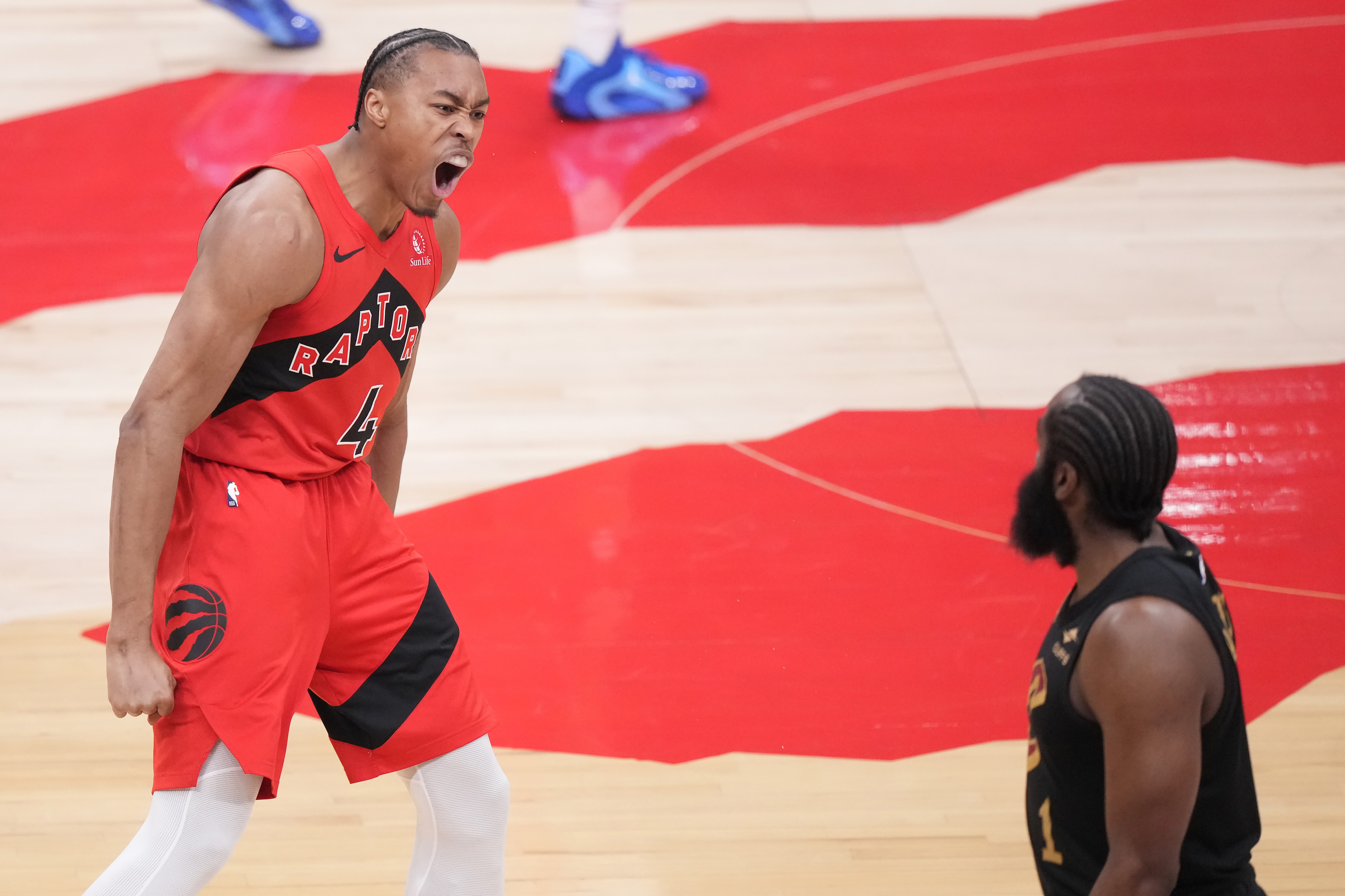 Toronto Raptors forward Scottie Barnes (4) reacts after making a basket as Cleveland Cavaliers guard James Harden (1) looks on during the first half of Game 4 in a first-round NBA basketball playoffs series in Toronto, Sunday, April 26, 2026. 