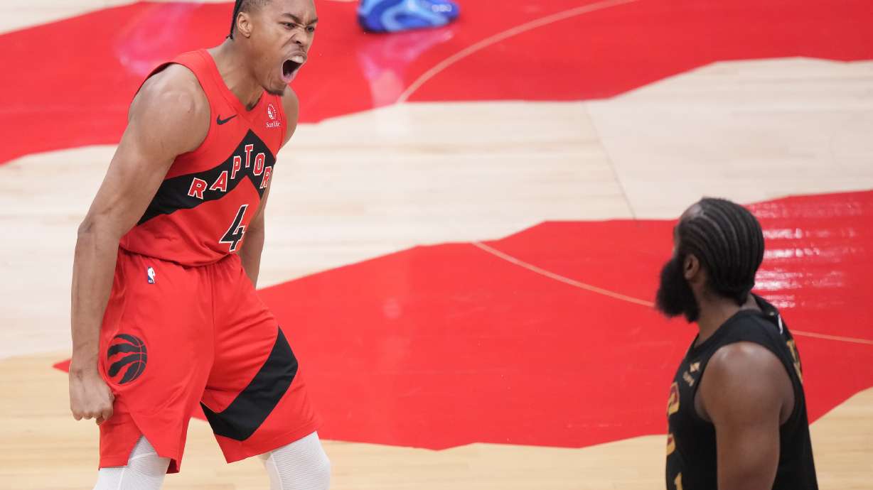 Toronto Raptors forward Scottie Barnes (4) reacts after making a basket as Cleveland Cavaliers guard James Harden (1) looks on during the first half of Game 4 in a first-round NBA basketball playoffs series in Toronto, Sunday, April 26, 2026.