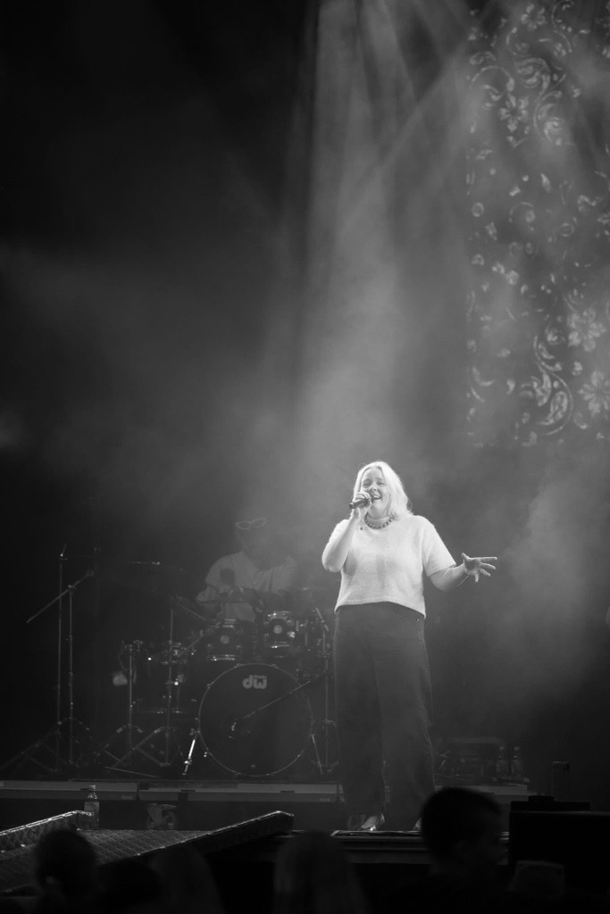 Emma Nissen performs on stage.