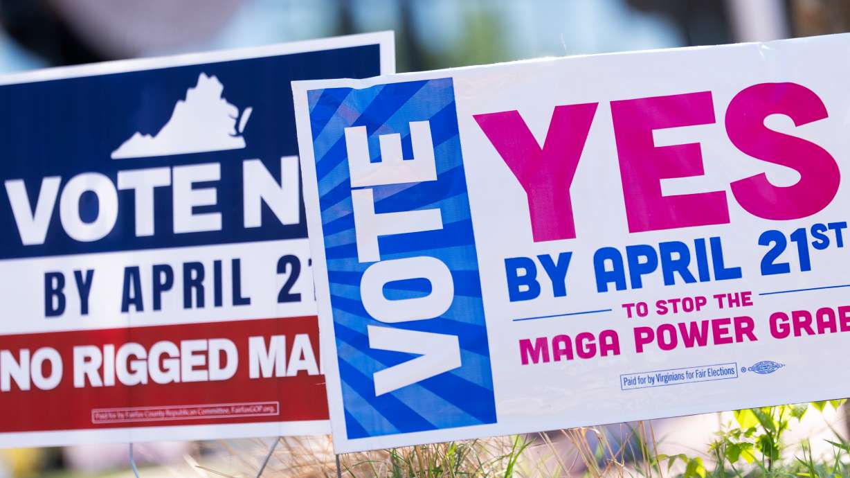Signs are seen outside Fairfax Government Center during the Virginia redistricting referendum, April 21, in Fairfax, Va.