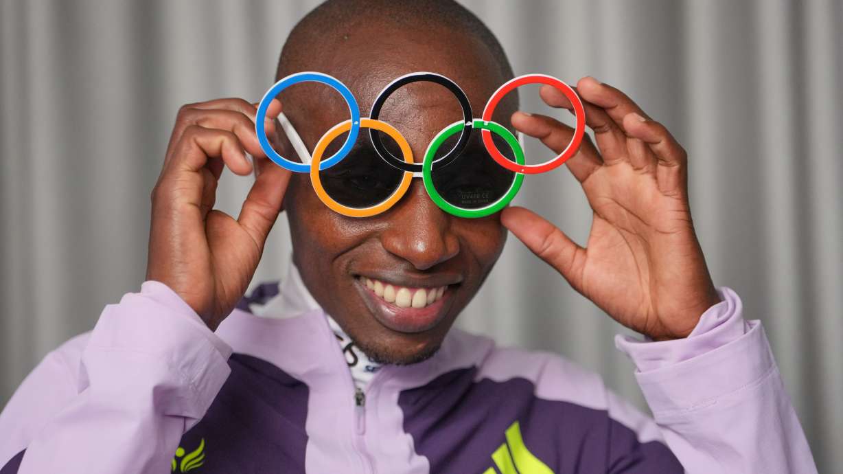 Kenya's Sabastian Sawe poses with Olympic Ring sun-glasses during an interview with The Associated Press after winning the London Marathon, in London, Monday, April 27, 2026.