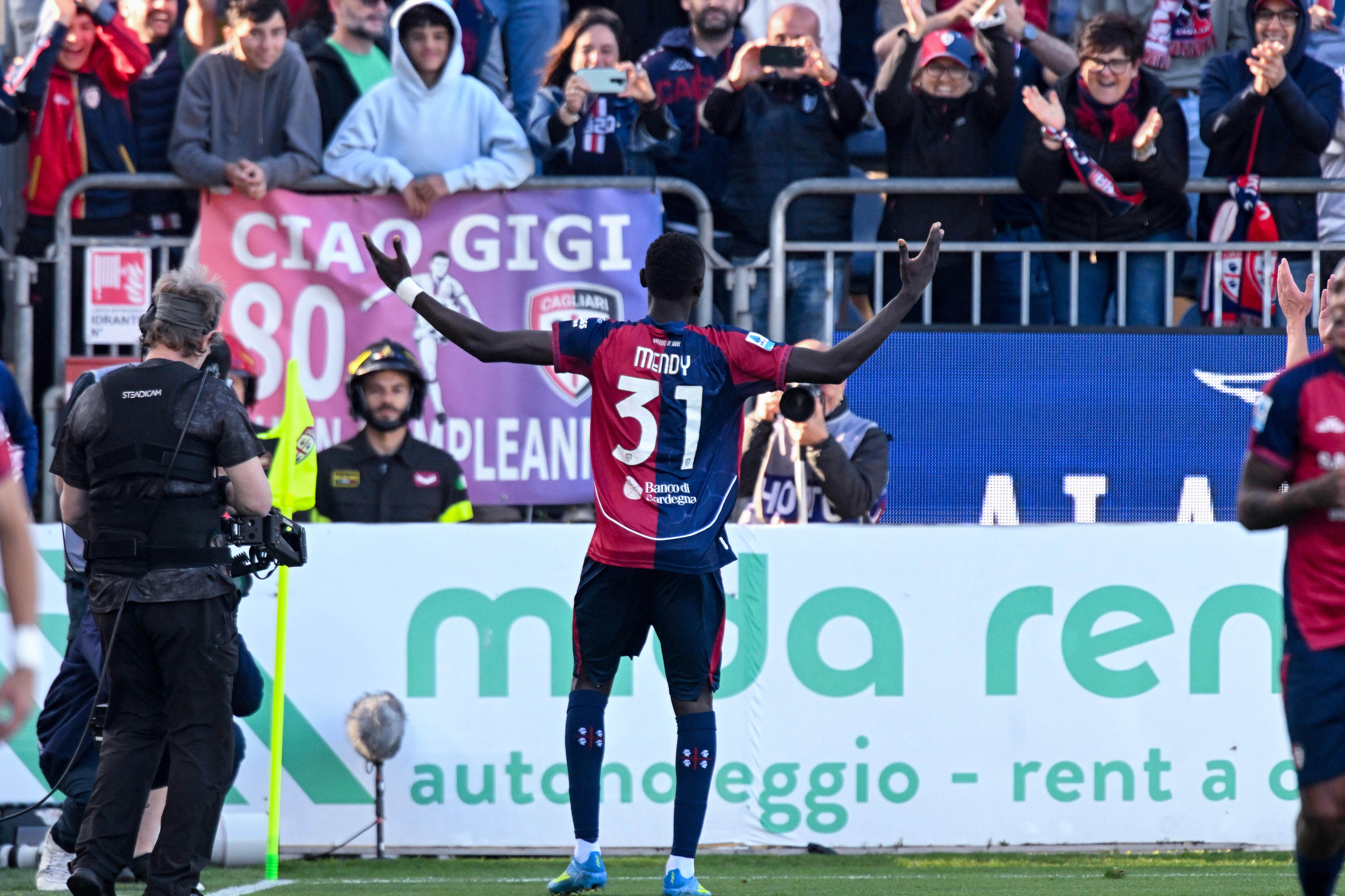 Cagliari's Paul Mendy celebrates after scoring during the Serie A soccer match between Cagliari and Atalanta, in Cagliari, Italy, Monday, April 27. 