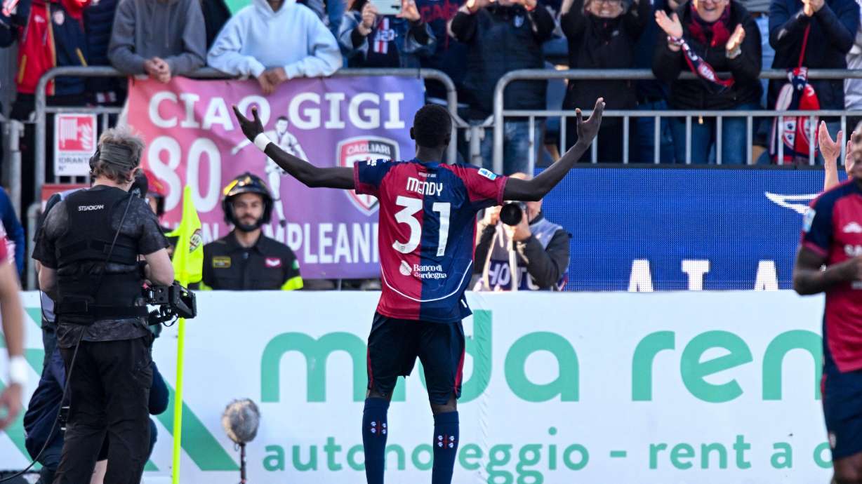 Cagliari's Paul Mendy celebrates after scoring during the Serie A soccer match between Cagliari and Atalanta, in Cagliari, Italy, Monday, April 27.