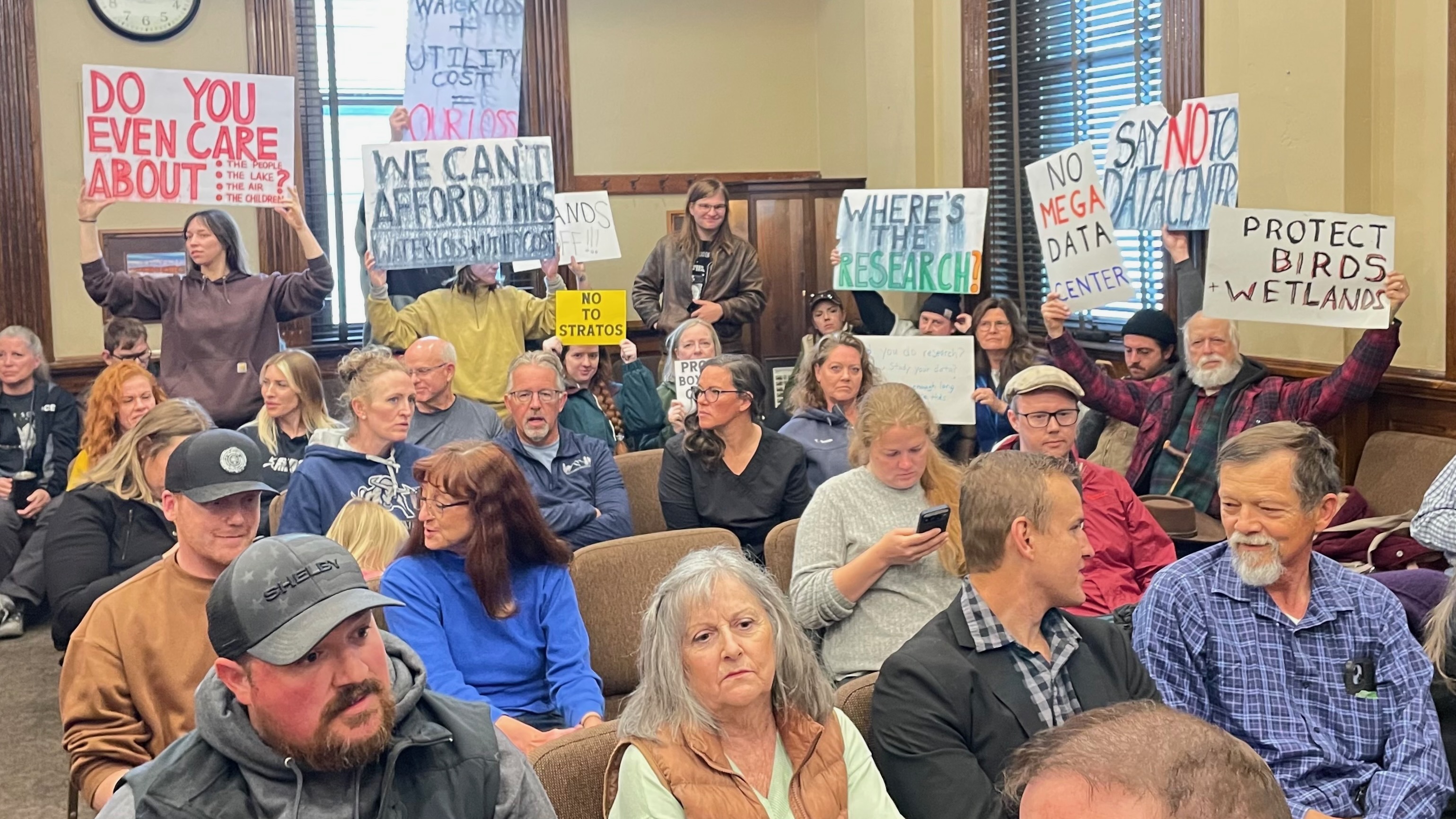 Amid lingering questions, Box Elder County commissioners on Monday tabled action on a data center proposal that recently came to public light. The photo shows protestors at the meeting, held at the Box Elder County Courthouse in Brigham City.