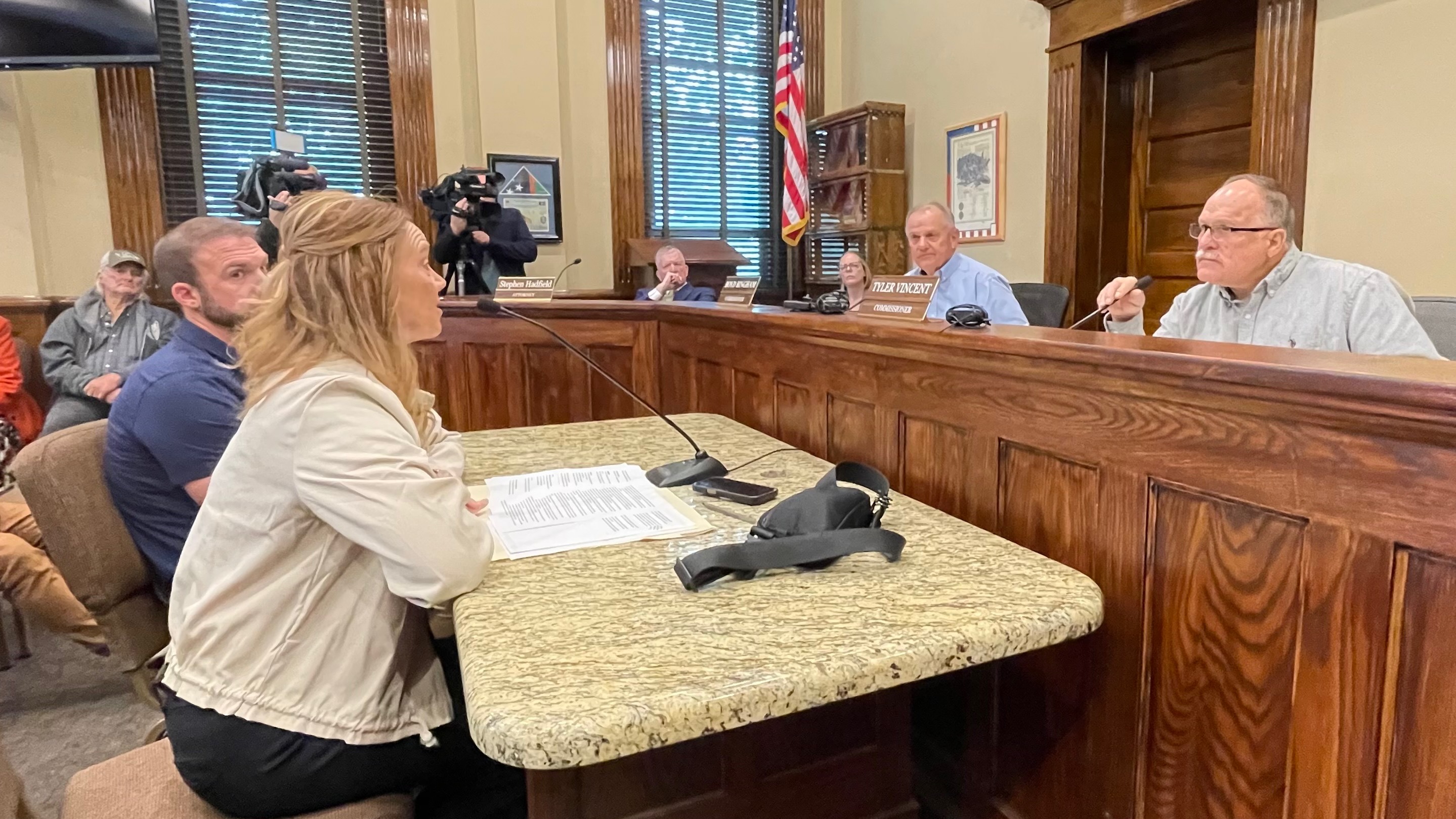 Box Elder County commissioners on Monday tabled action on a data center proposal that recently came to public light. The photo shows County Commission Chairman Tyler Vincent, right, listening to Hilary Venable of MIDA. The meeting was held at the Box Elder County Courthouse in Brigham City.