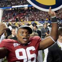 Former Alabama tackle pleads guilty to defrauding investors using wigs to impersonate NFL players