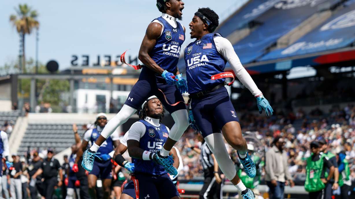 U.S. National Flag team's Isaiah Calhoun celebrates with teammate Shawn Theard Jr. at the Fanatics Flag Football Classic, March 21, in Los Angeles. Flag football will make its Olympic debut in 2028, according to Olympics.com