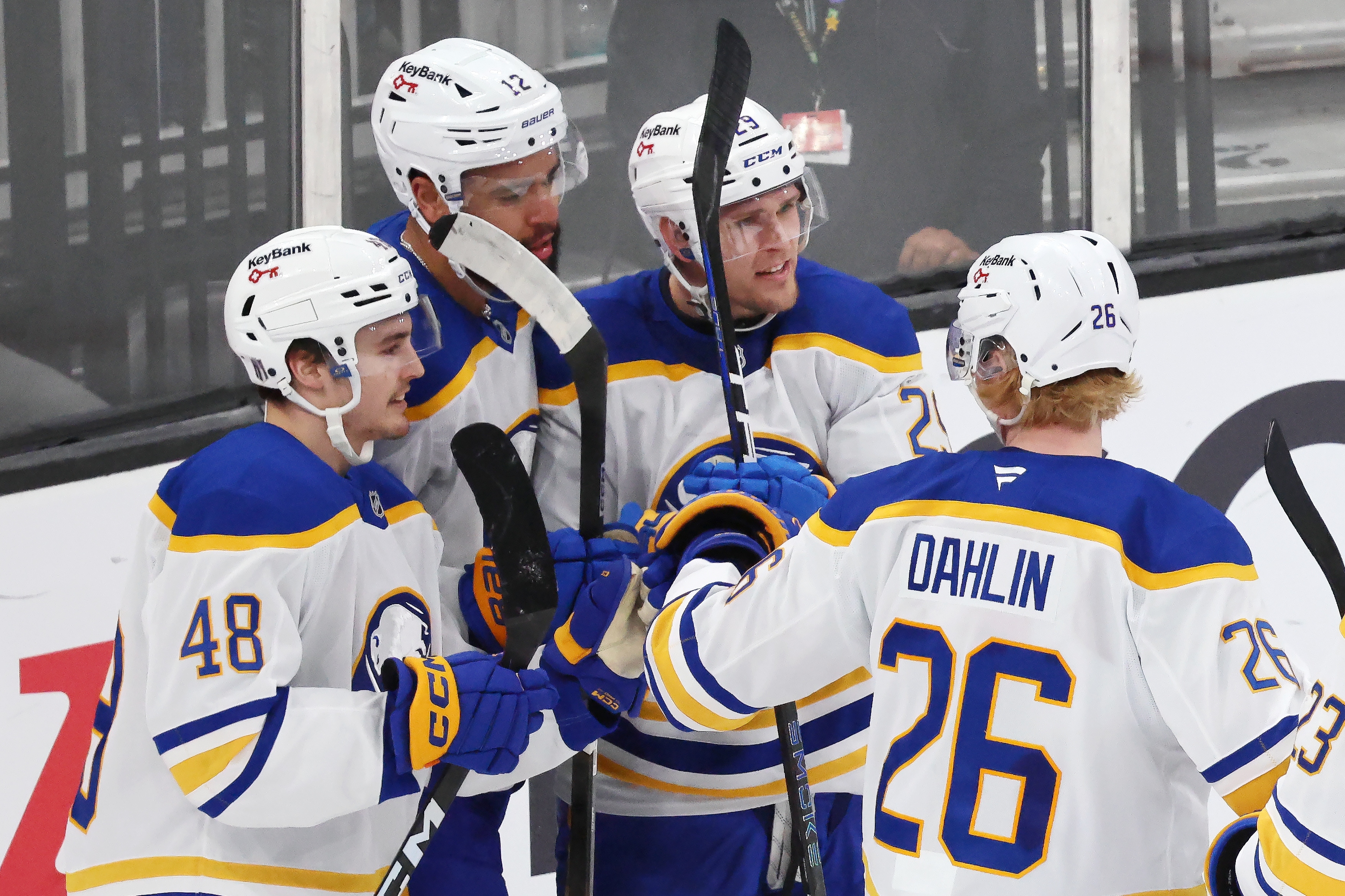 Buffalo Sabres' Beck Malenstyn (29) celebrates after his goal with teammates Tyson Kozak (48), Jordan Greenway (12) and Rasmus Dahlin (26) during the third period in Game 4 of a first-round NHL hockey Stanley Cup playoff series against the Boston Bruins, Sunday, April 26, 2026 against the Boston Bruins, in Boston. 
