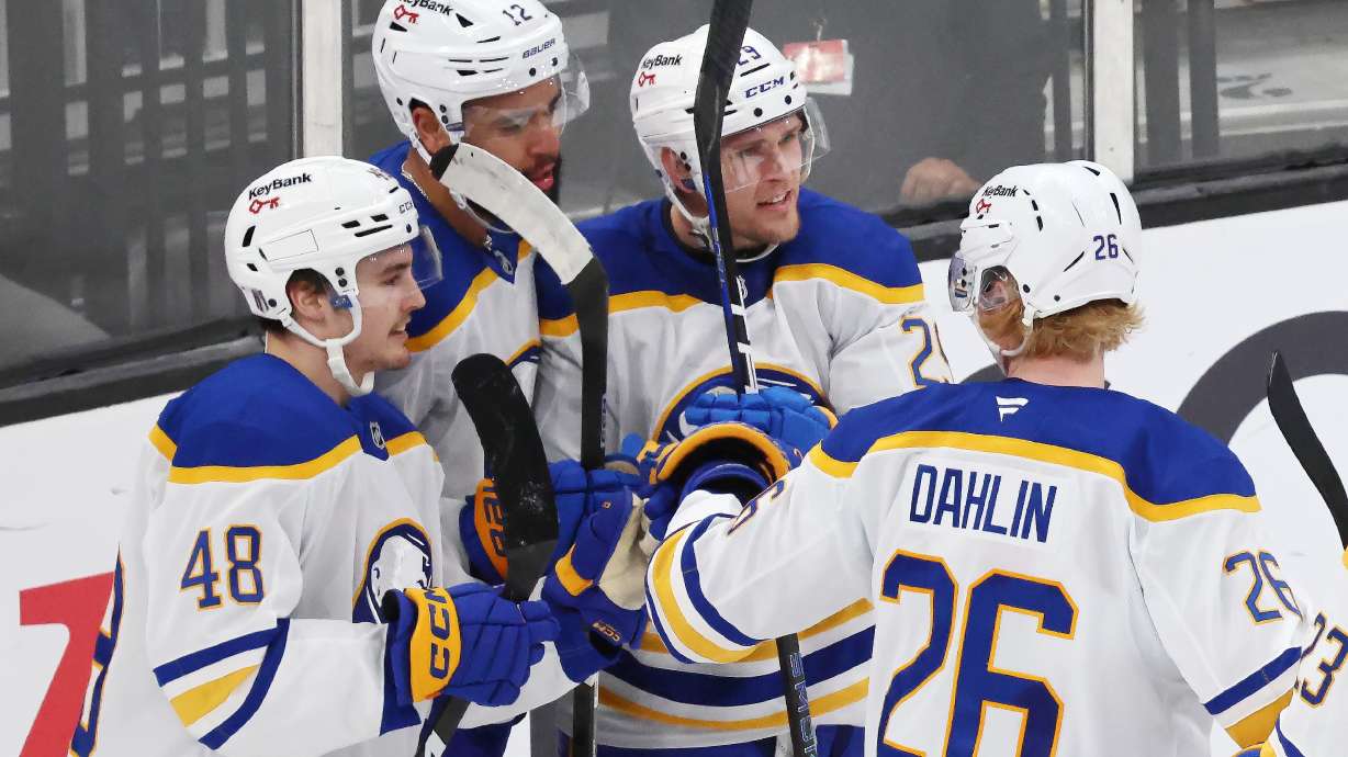Buffalo Sabres' Beck Malenstyn (29) celebrates after his goal with teammates Tyson Kozak (48), Jordan Greenway (12) and Rasmus Dahlin (26) during the third period in Game 4 of a first-round NHL hockey Stanley Cup playoff series against the Boston Bruins, Sunday, April 26, 2026 against the Boston Bruins, in Boston.