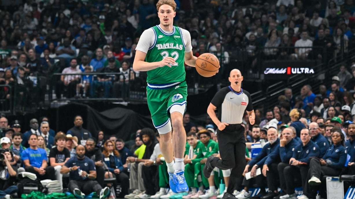 Dallas Mavericks' Cooper Flagg brings the ball up court during an NBA basketball game against the Chicago Bulls Sunday, April 12, 2026, in Dallas.