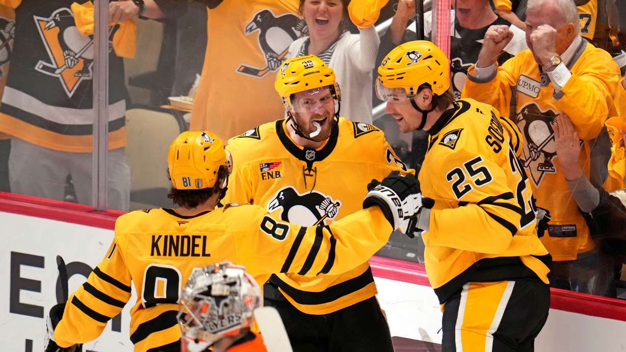 Pittsburgh Penguins' Elmer Soderblom (25) celebrates with Ben Kindel (81) and Anthony Mantha (39) after scoring against the Philadelphia Flyers during the first period of Game 5 in the first round of an NHL hockey Stanley Cup playoff series in Pittsburgh, Monday, April 27, 2026.