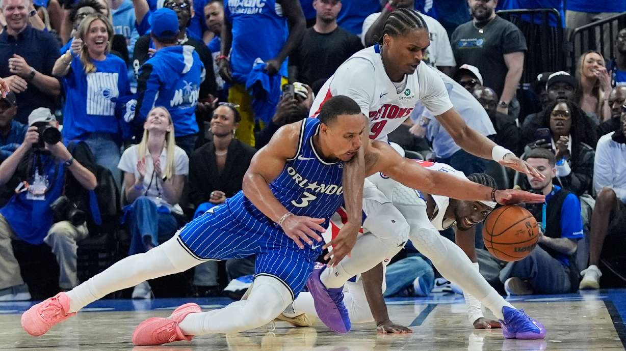 Orlando Magic guard Desmond Bane (3) goes after a loose ball against Detroit Pistons guard Ausar Thompson during the second half in Game 4 of a first-round NBA basketball playoff series, Monday, April 27, 2026, in Orlando, Fla.
