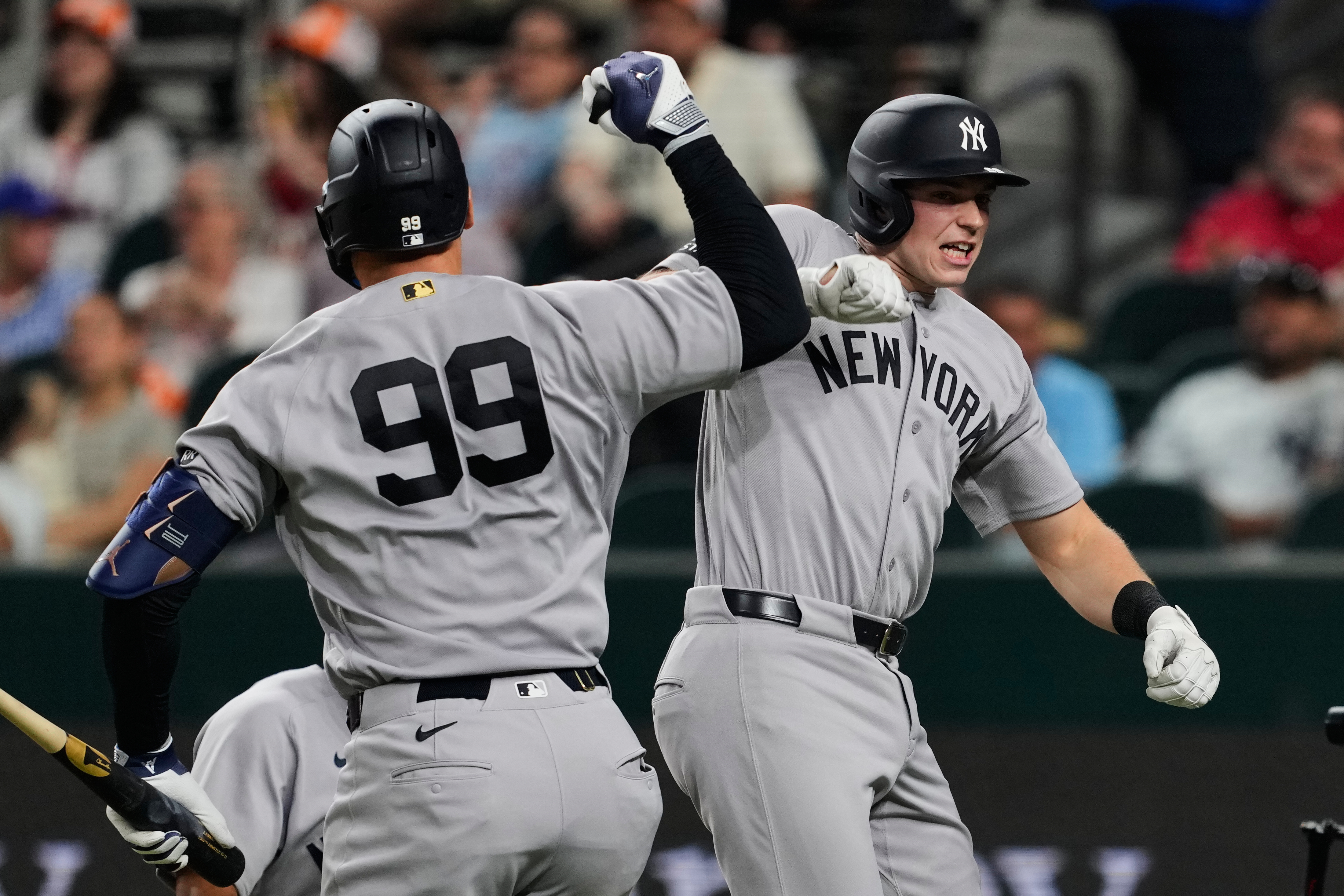 New York Yankees' Aaron Judge and Ben Rice, right, celebrate Rice's two-run home run in the third inning of a baseball game against the Texas Rangers Monday, April 27, 2026, in Arlington, Texas. 