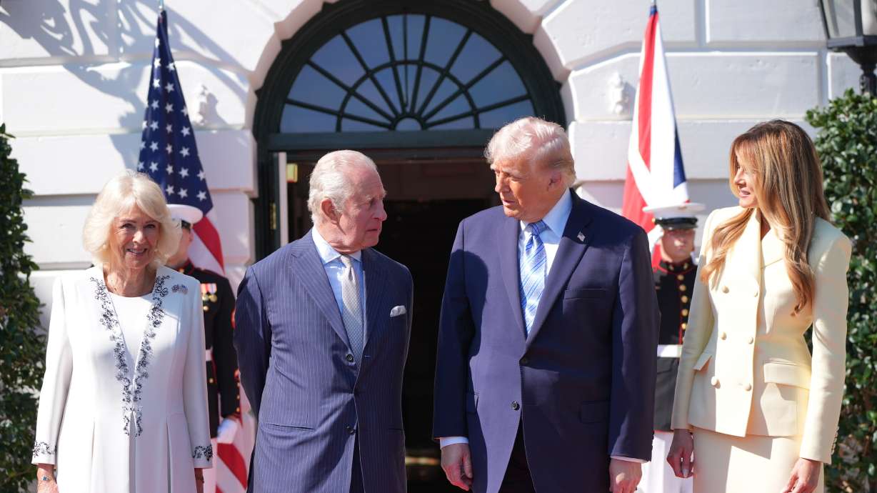 President Donald Trump and first lady Melania Trump greet King Charles III and Queen Camilla as they arrive at the White House, Monday, in Washington.