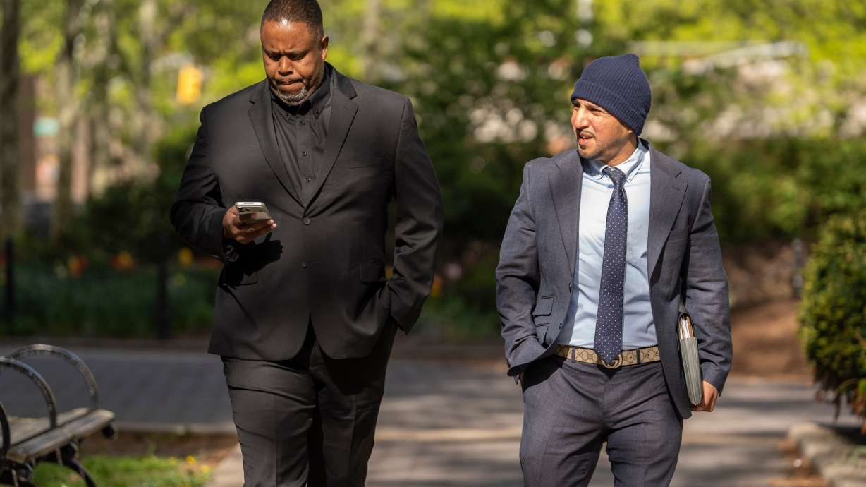 Former NBA player and assistant coach Damon Jones, left, arrives at Brooklyn federal court, Tuesday, April 28, 2026, in New York.