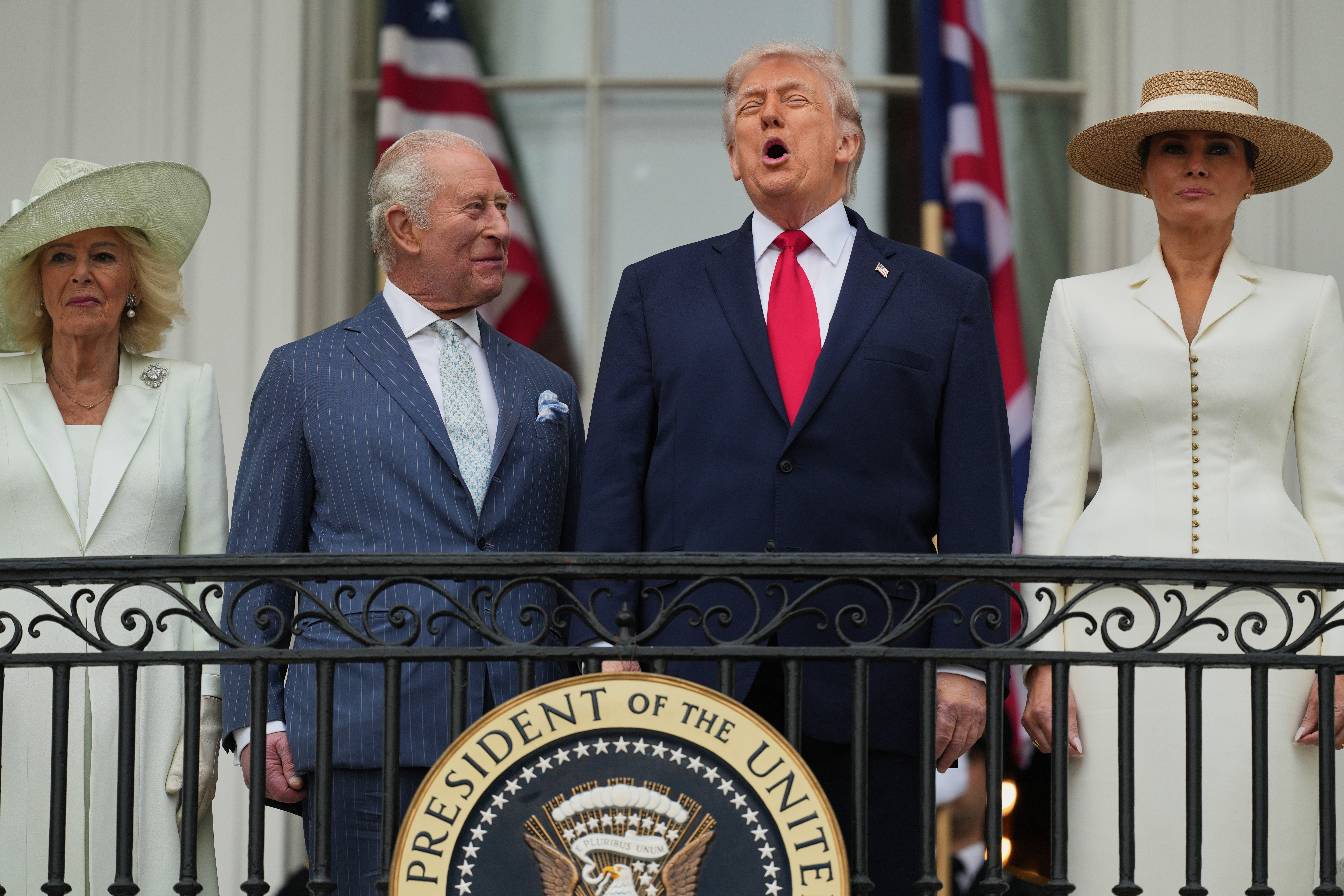 President Donald Trump and Britain's King Charles III laugh together while Queen Camilla and first lady Melania Trump watch an arrival ceremony on the South Lawn of the White House, Tuesday, in Washington. Charles is seeking to mend U.S.-UK ties and highlight the alliance between the two nations.