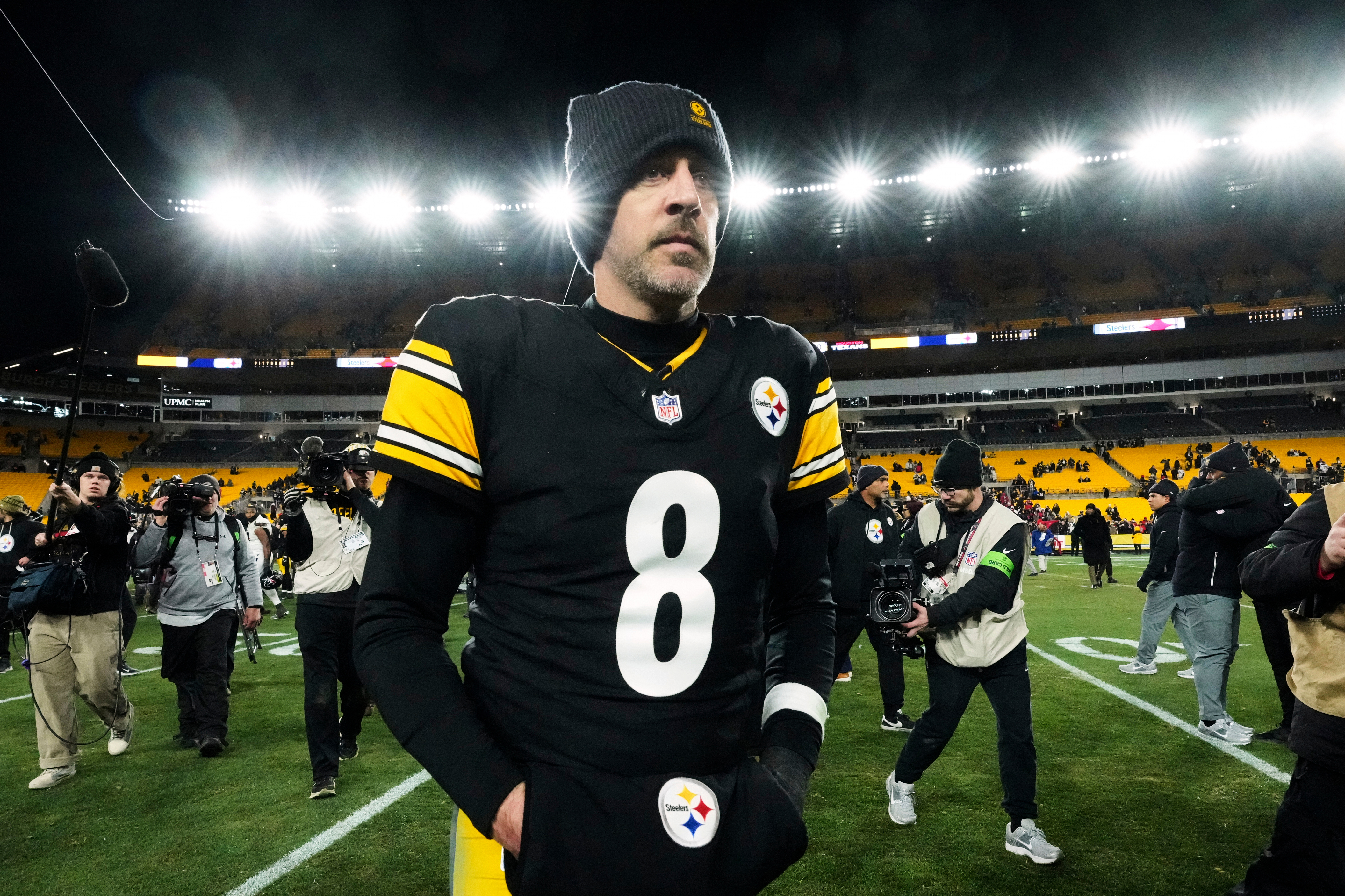 FILE - Pittsburgh Steelers quarterback Aaron Rodgers (8) leaves the field after an NFL wild-card playoff football game against the Houston Texans, Monday, Jan. 12, 2026, in Pittsburgh. 
