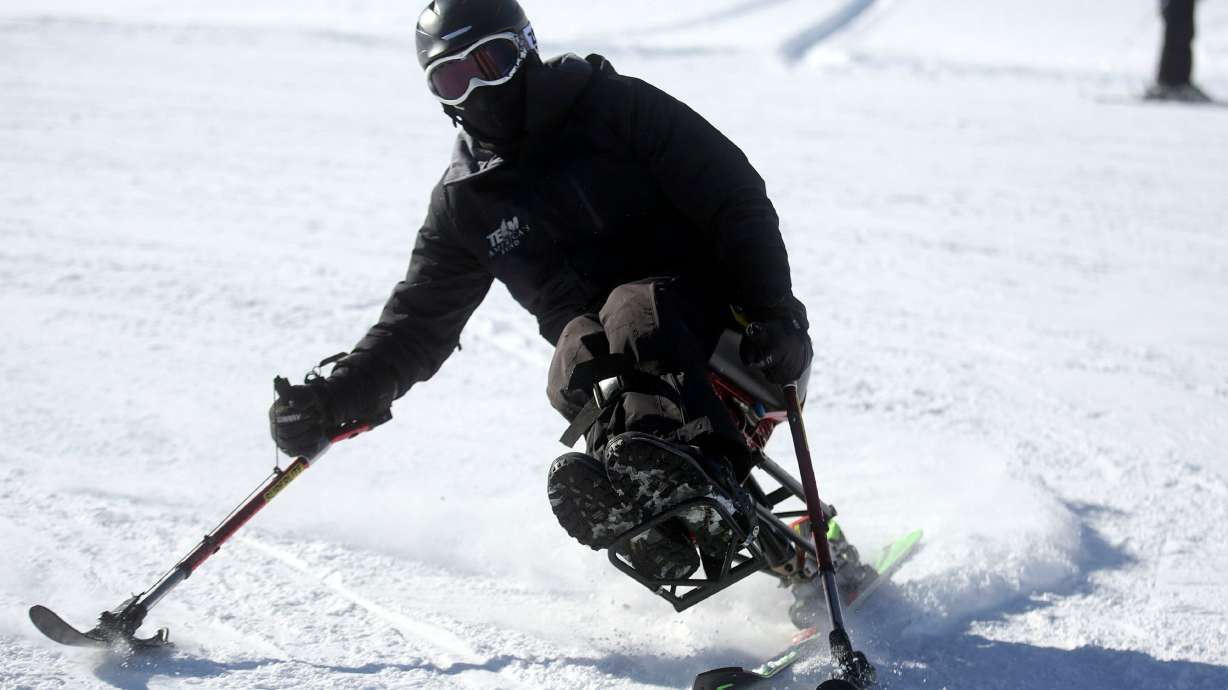 Egor Titovets skis on a monoski during the Semper Fi Fund's ski and snowboard clinic at Park City Mountain Resort in Park City on Jan. 22, 2019. During the event, 25 veterans with physical disabilities, sensory impairments or post-traumatic stress disorder symptoms received lessons through the National Ability Center.