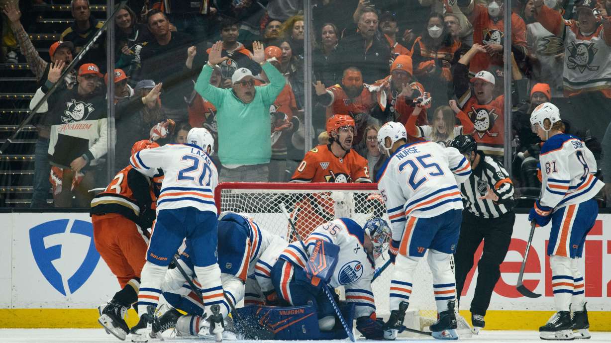 Anaheim Ducks left wing Chris Kreider, top center, reacts on the game-winning, overtime goal by center Ryan Poehling, not shown, in Game 4 in the first round of an NHL hockey Stanley Cup playoff series against the Edmonton Oilers, Sunday, April 26, 2026, in Anaheim, Calif.