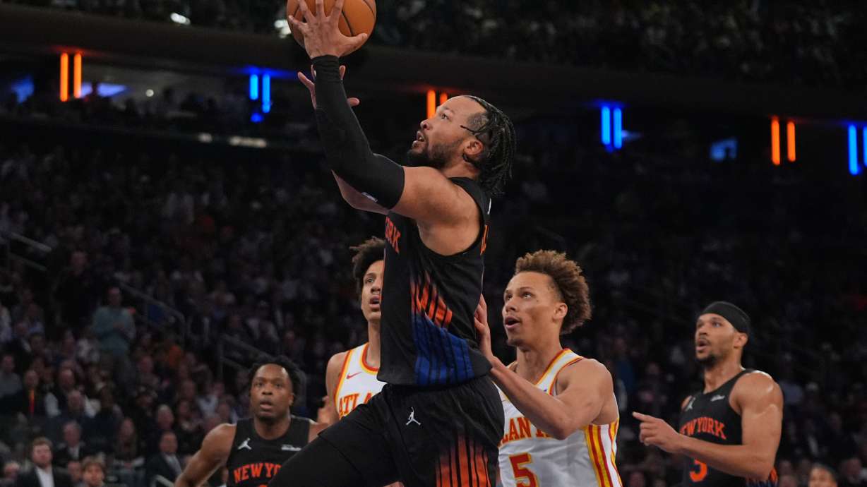 New York Knicks' Jalen Brunson drives past Atlanta Hawks' Dyson Daniels (5) during the first half in Game 5 of a first-round NBA playoffs basketball series, Tuesday, April 28, 2026, in New York.