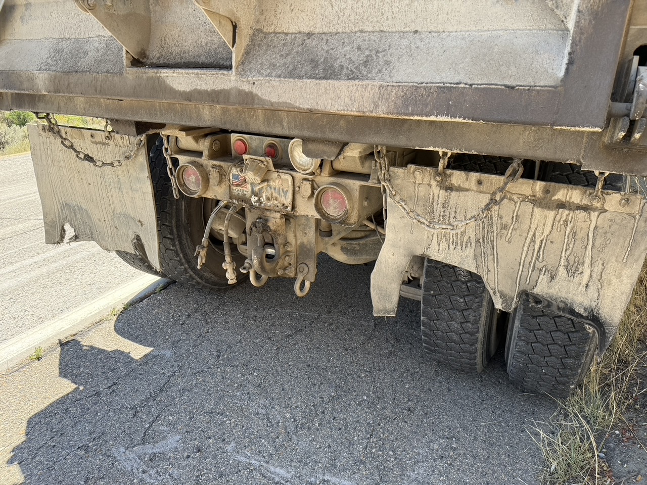 The worn mud flaps of the dump truck that alleged kicked up a rock that damaged Philip Munoa's windshield, Tuesday. Munoa said the truck company refused to pay for damaging his windshield.