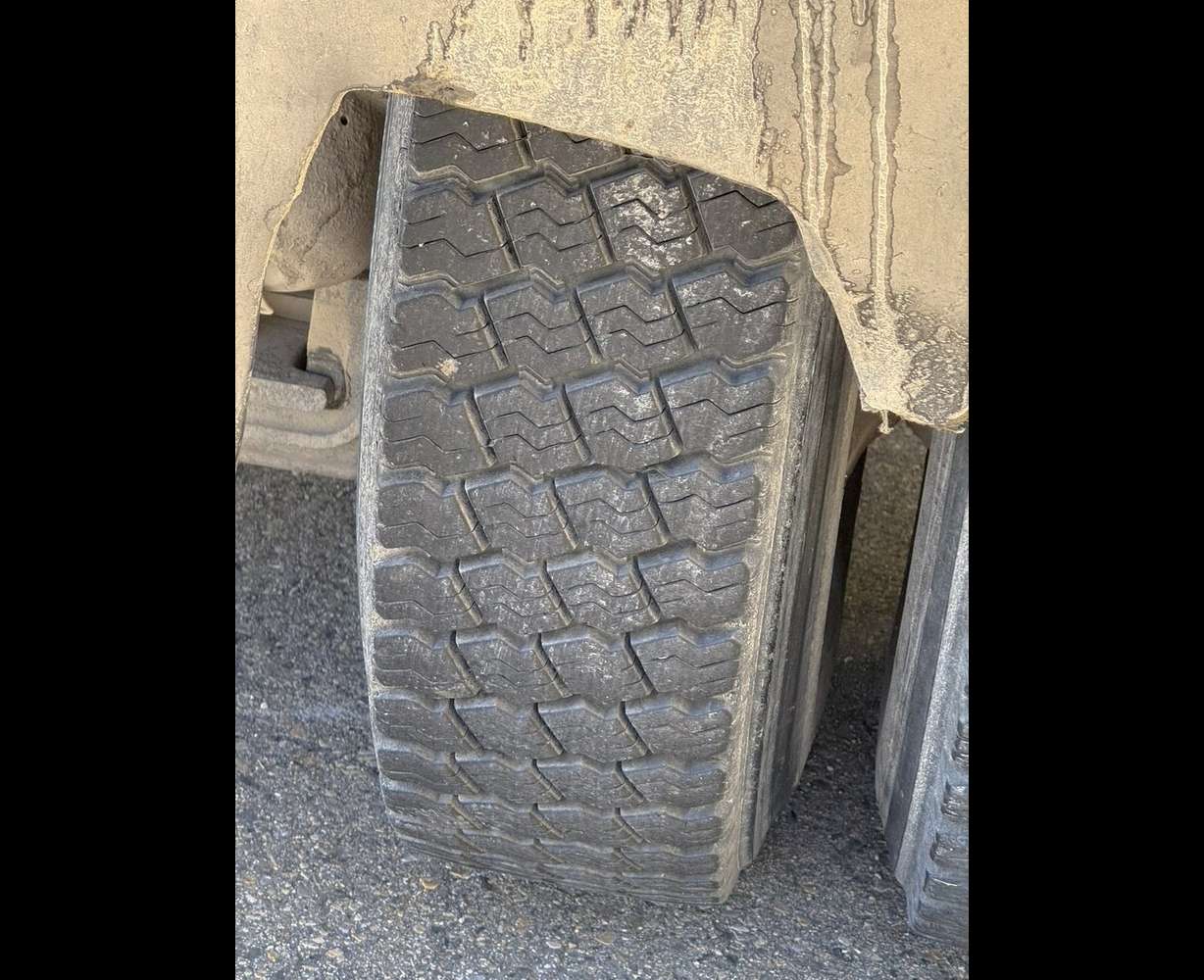 The worn mud flaps of the dump truck that alleged kicked up a rock that damaged Philip Munoa's windshield. Munoa said the truck company refused to pay for damaging his windshield.